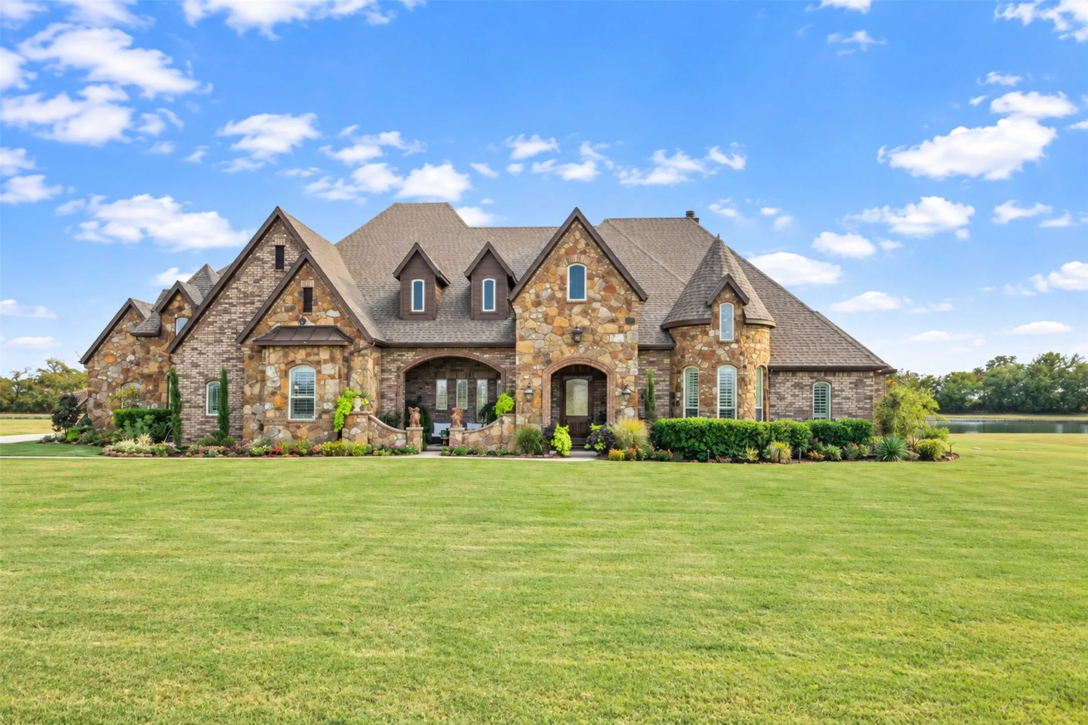 Stone and brick exterior with multiple gables