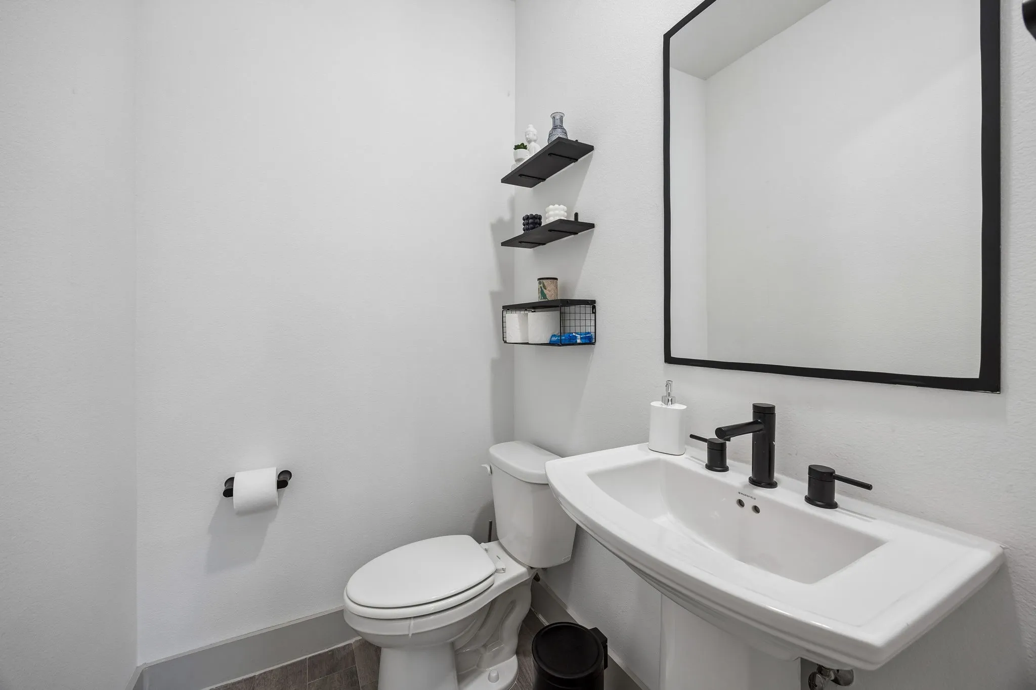 There are two half baths. One on the 1st floor by the covered patio and courtyard, and one on the 2nd floor off of the kitchen.