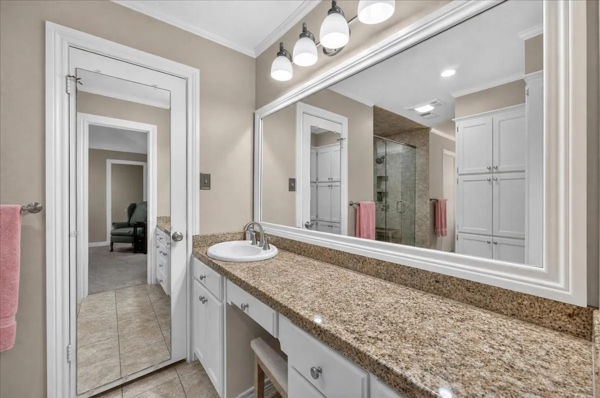 His and Her sinks and vanities on separate wings of primary bath.