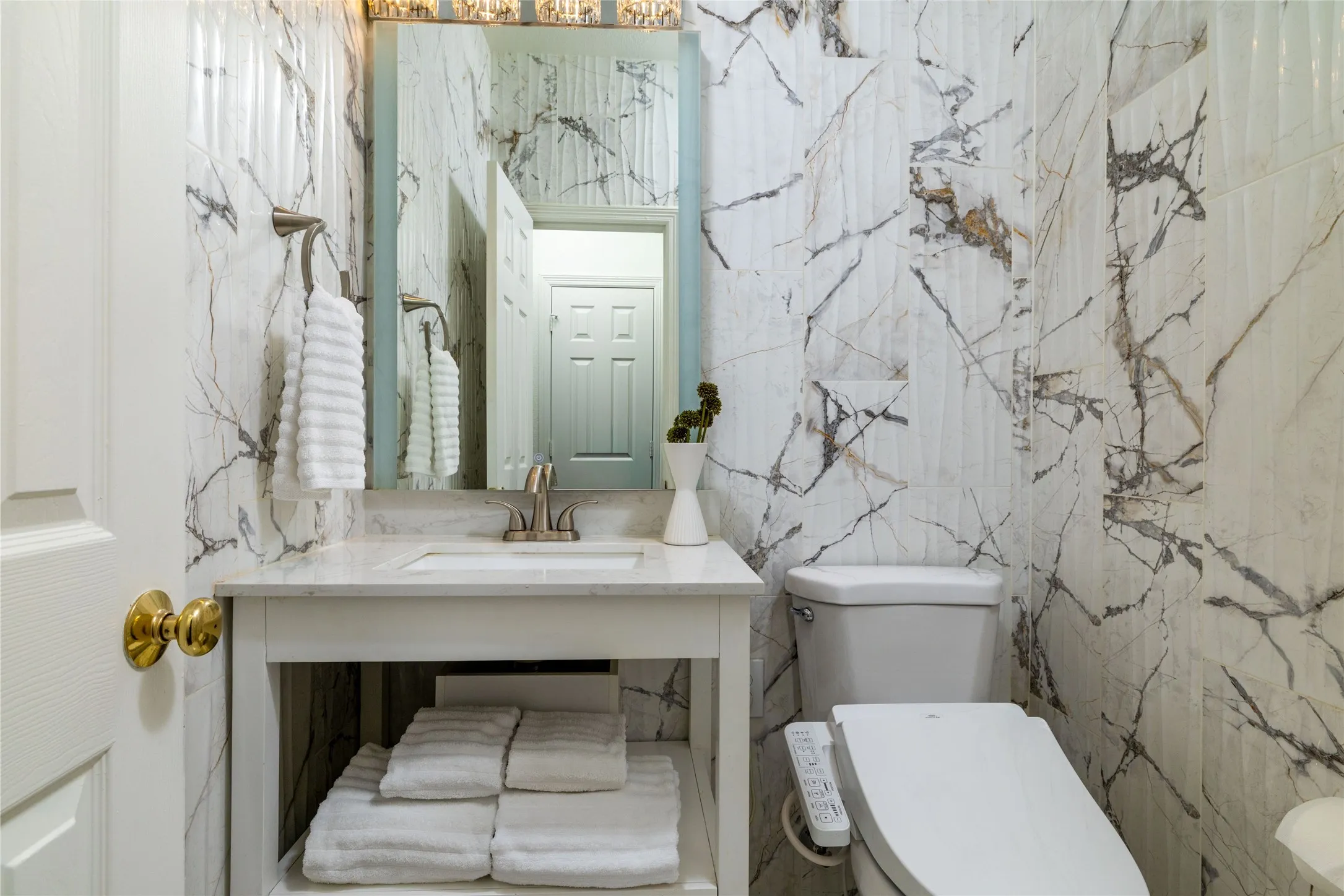 Vanity with integrated sink and chrome faucet