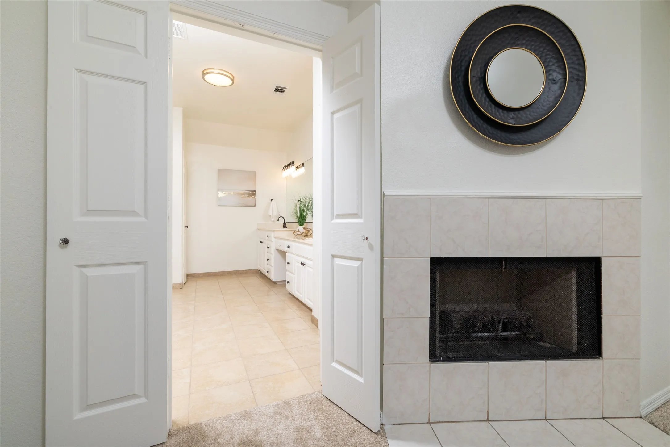 Tile-surround fireplace with a classic mantel