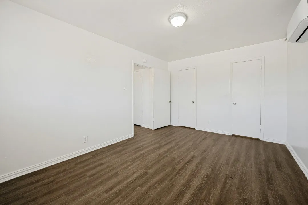 Wood-finish flooring with white walls