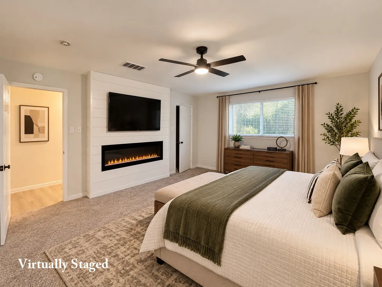 Shiplap accent wall with built-in linear fireplace, ceiling fan, carpet flooring, and window with blinds