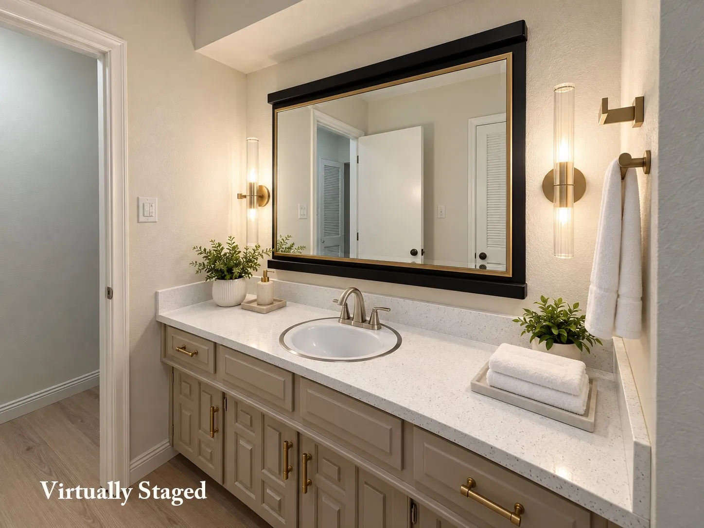 Vanity with a light-toned countertop, undermount sink, and brushed nickel faucet
