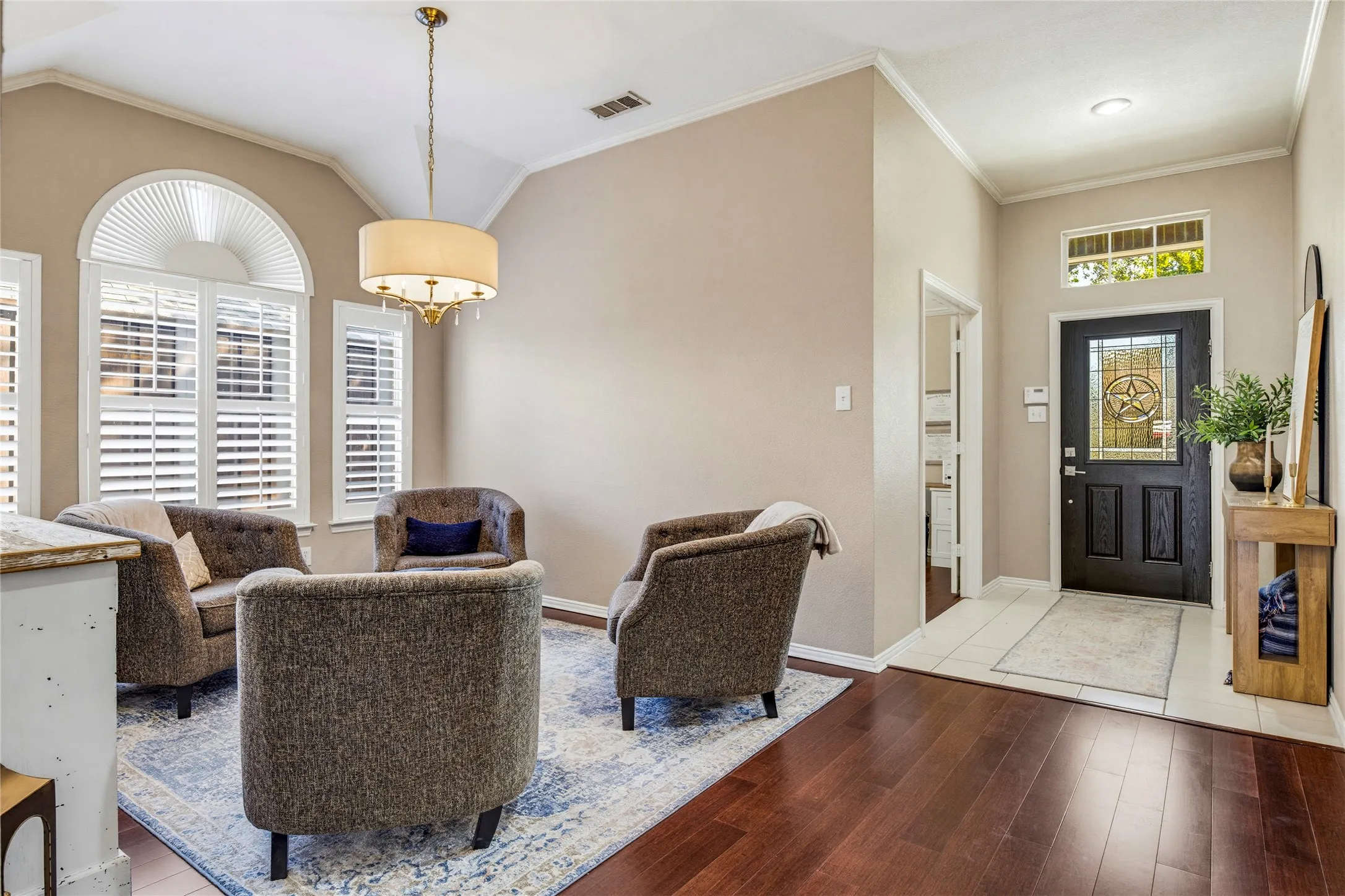 The dining room has been used as a sitting room with four chairs to create a conversation area.