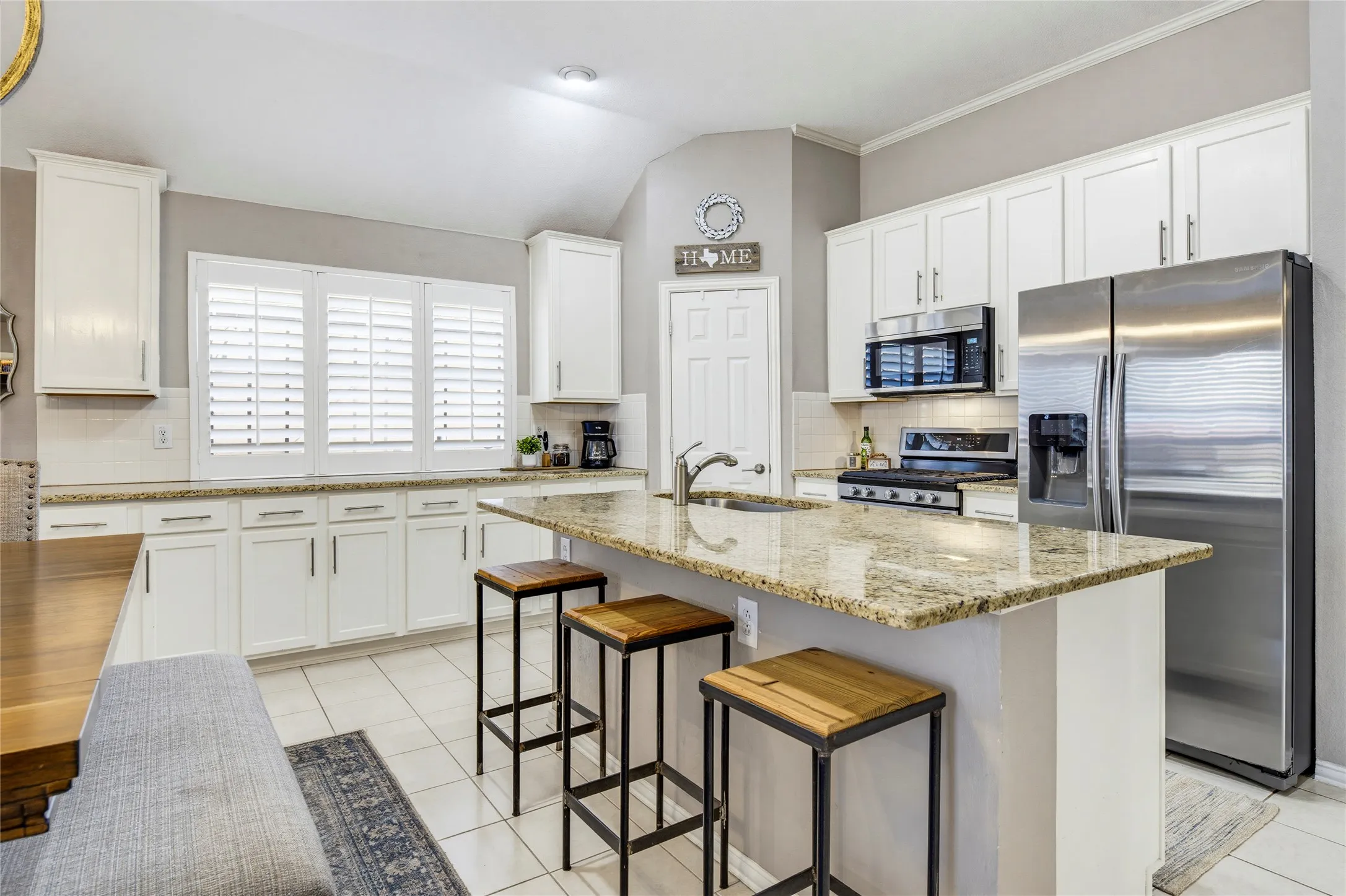 White painted cabinets, stainless steel appliances, and granite counters!!