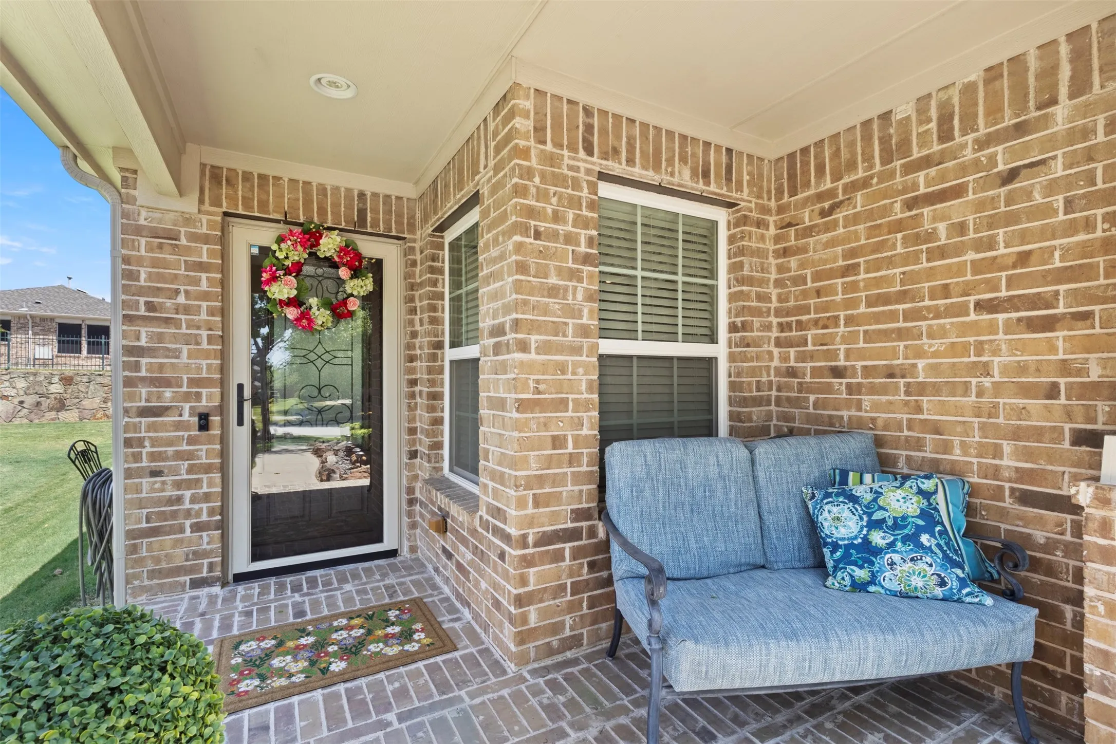Brick exterior with a covered porch