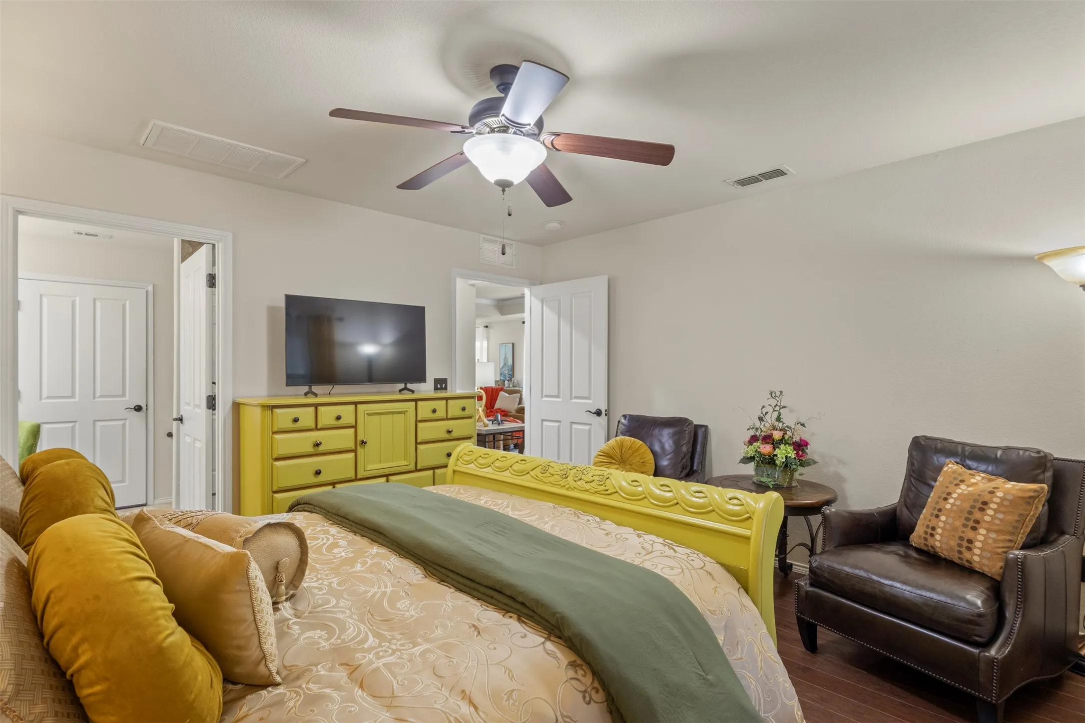 Wood-finish flooring with a ceiling fan light fixture