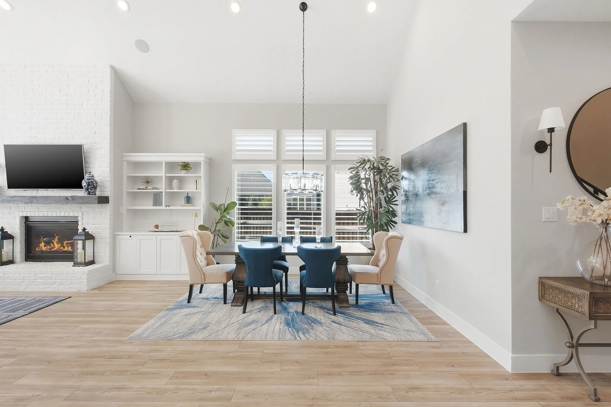 Gourmet kitchen with a large center island, white cabinetry, and stainless steel appliances