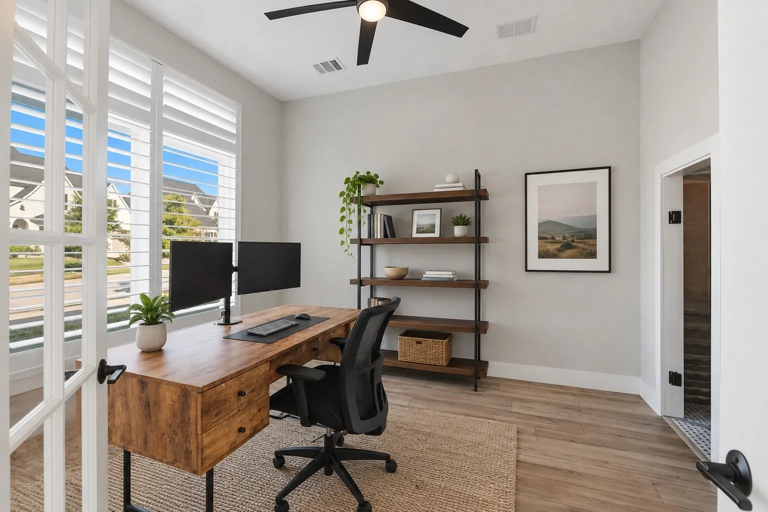 French doors, wood-finish flooring, white plantation shutters, and a ceiling fan