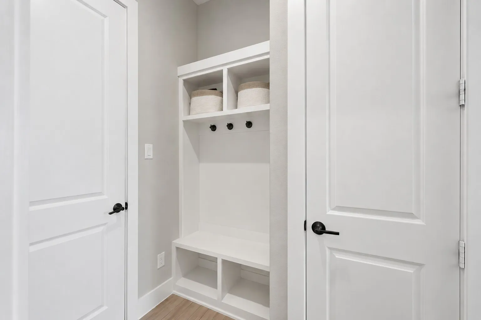 Gourmet kitchen with a large center island, white cabinetry, and stainless steel appliances