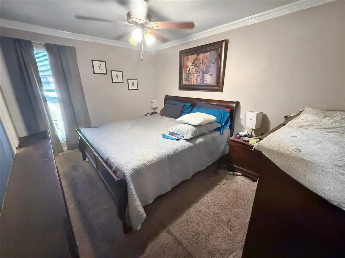 Spacious bedroom perspective showing room setup and open floor space.