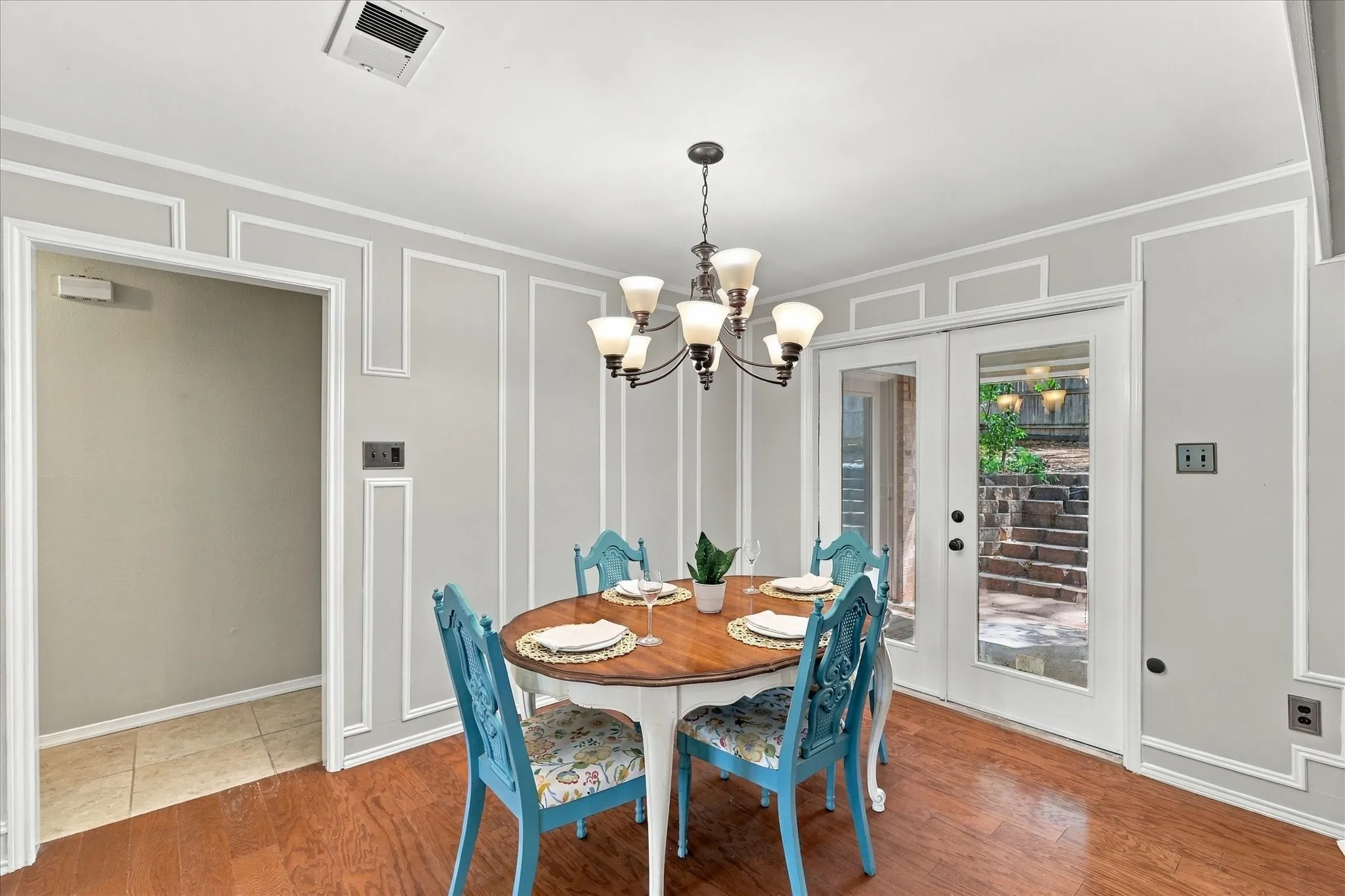 Wood-finish flooring with decorative wall molding
