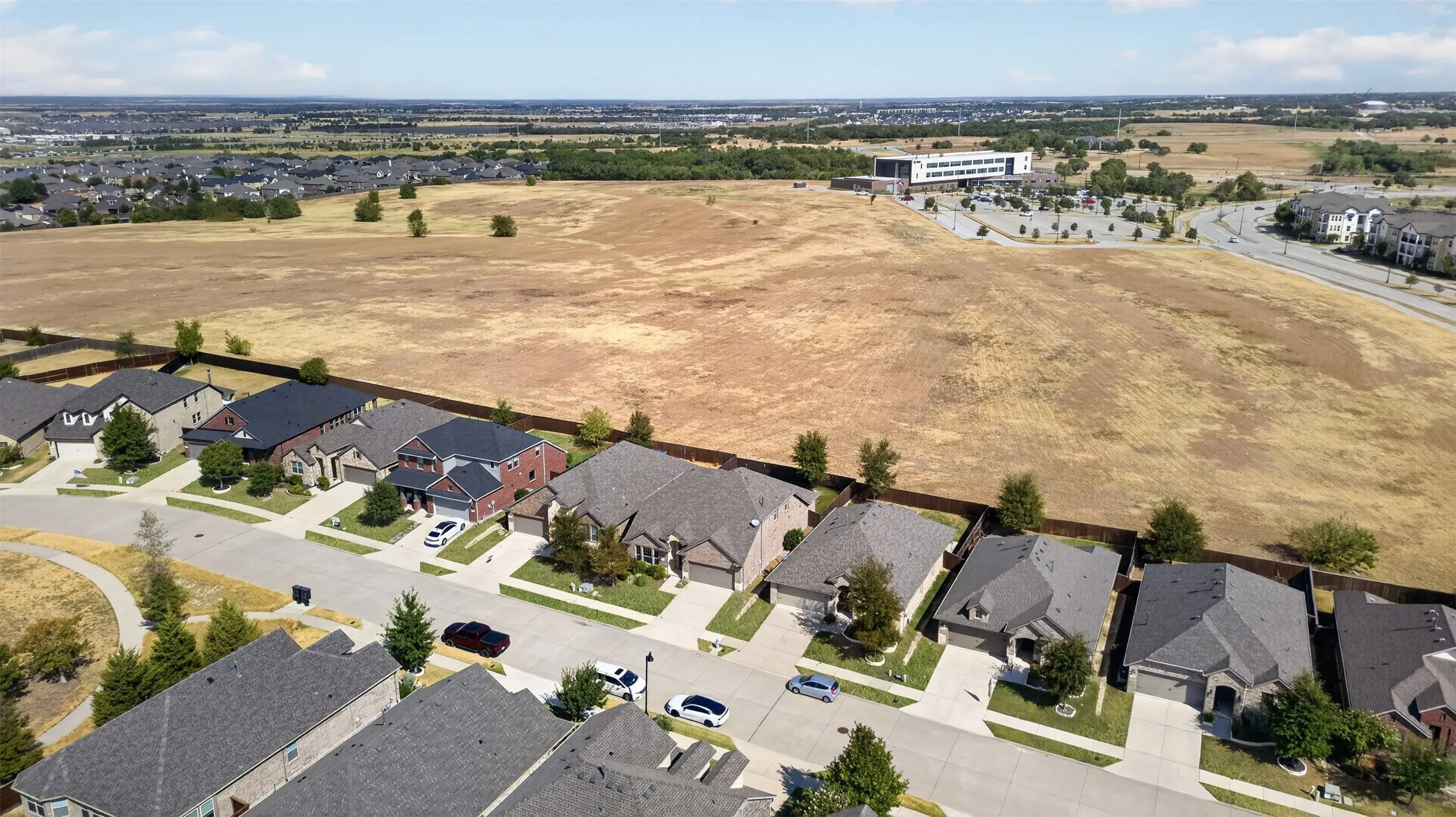 House backs to Collin college green space