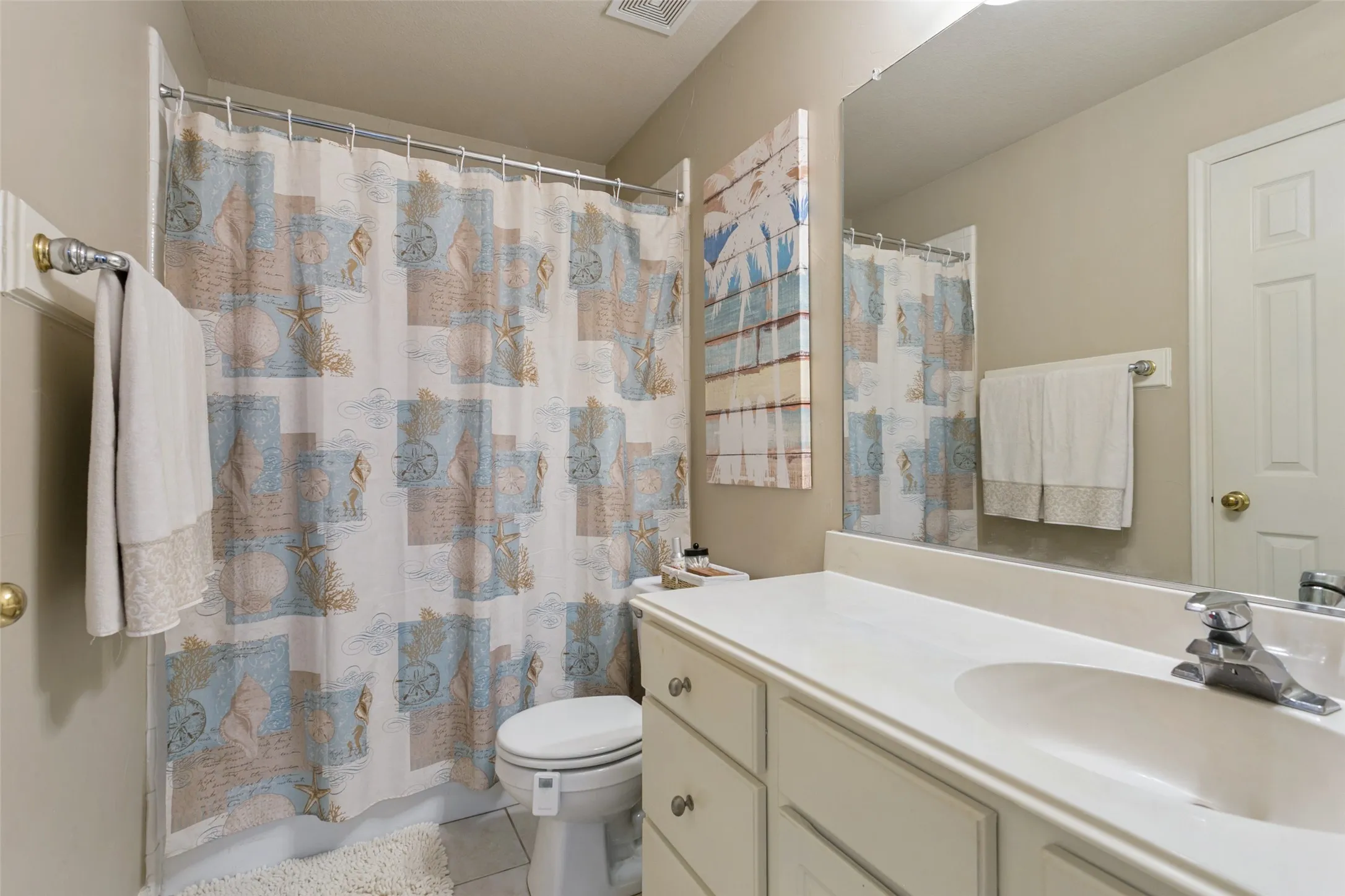 Single vanity with an integrated sink, polished chrome faucet, and ample under-sink storage