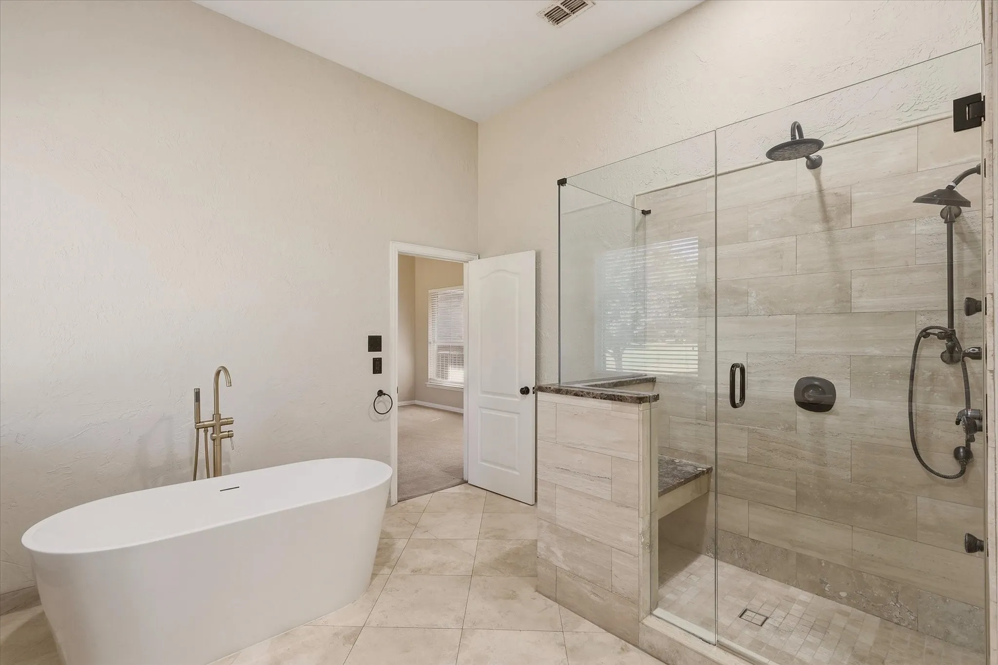Primary Bath with soaking tub and separate shower.