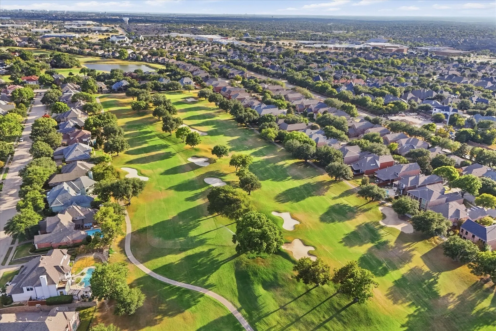Aerial view of the golf course behind the home.