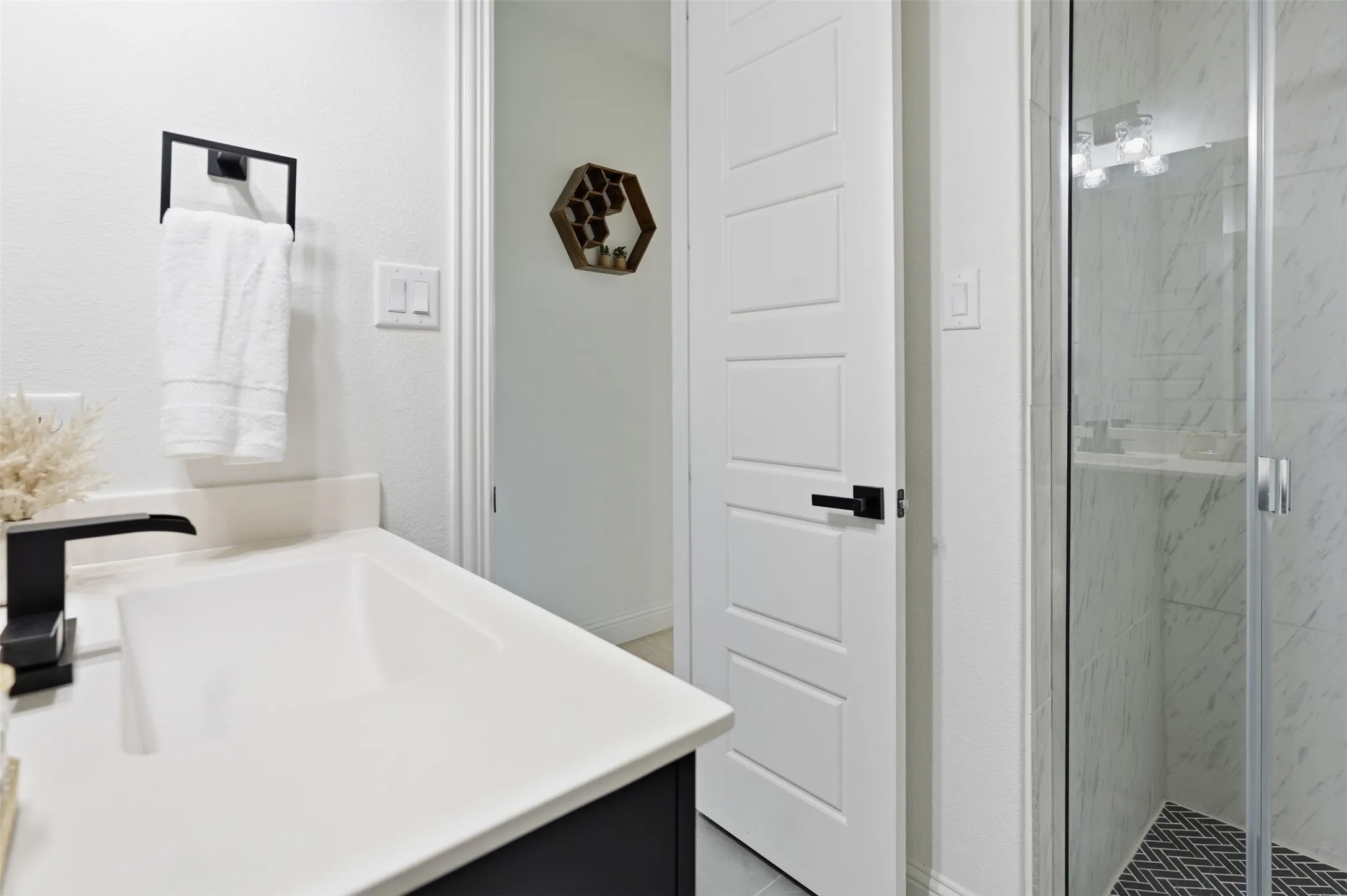 Downstairs Bathroom with shower -Modern vanity with a rectangular basin sink and matte black faucet