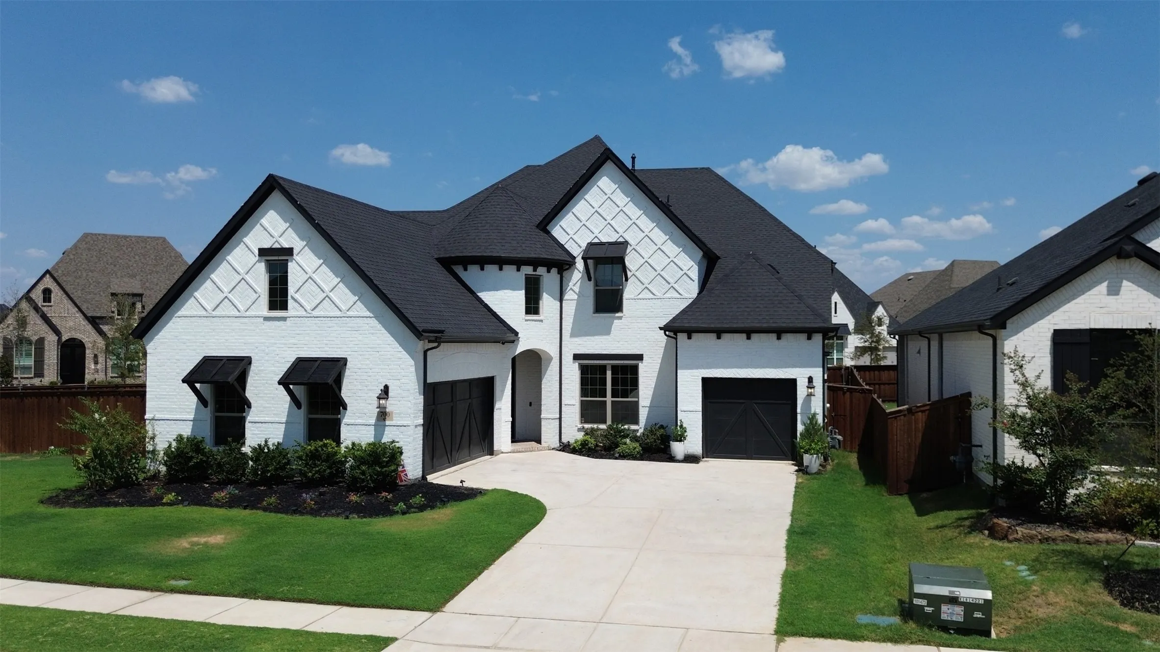 White brick exterior with dark trim accents