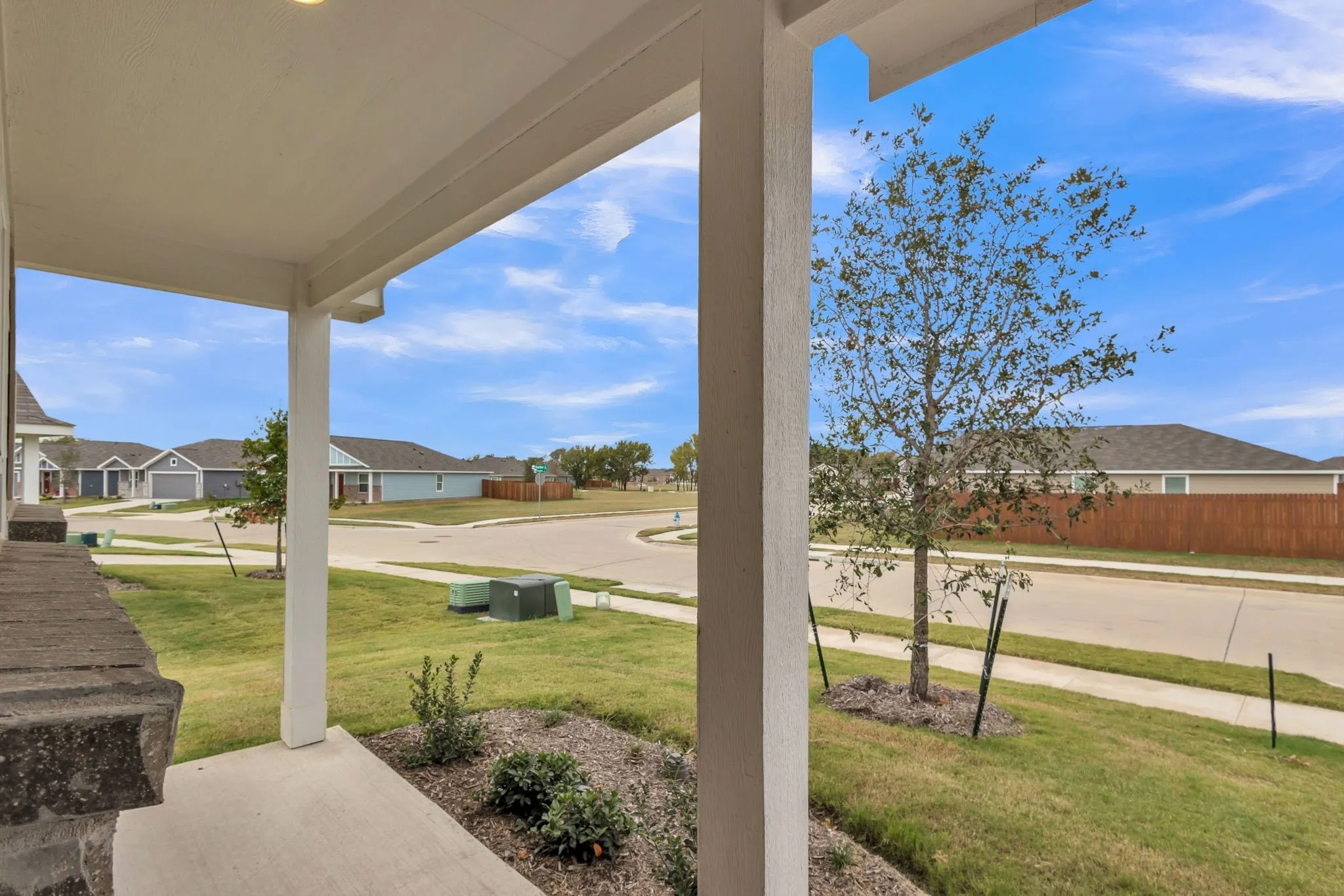 Covered front porch with recessed lighting