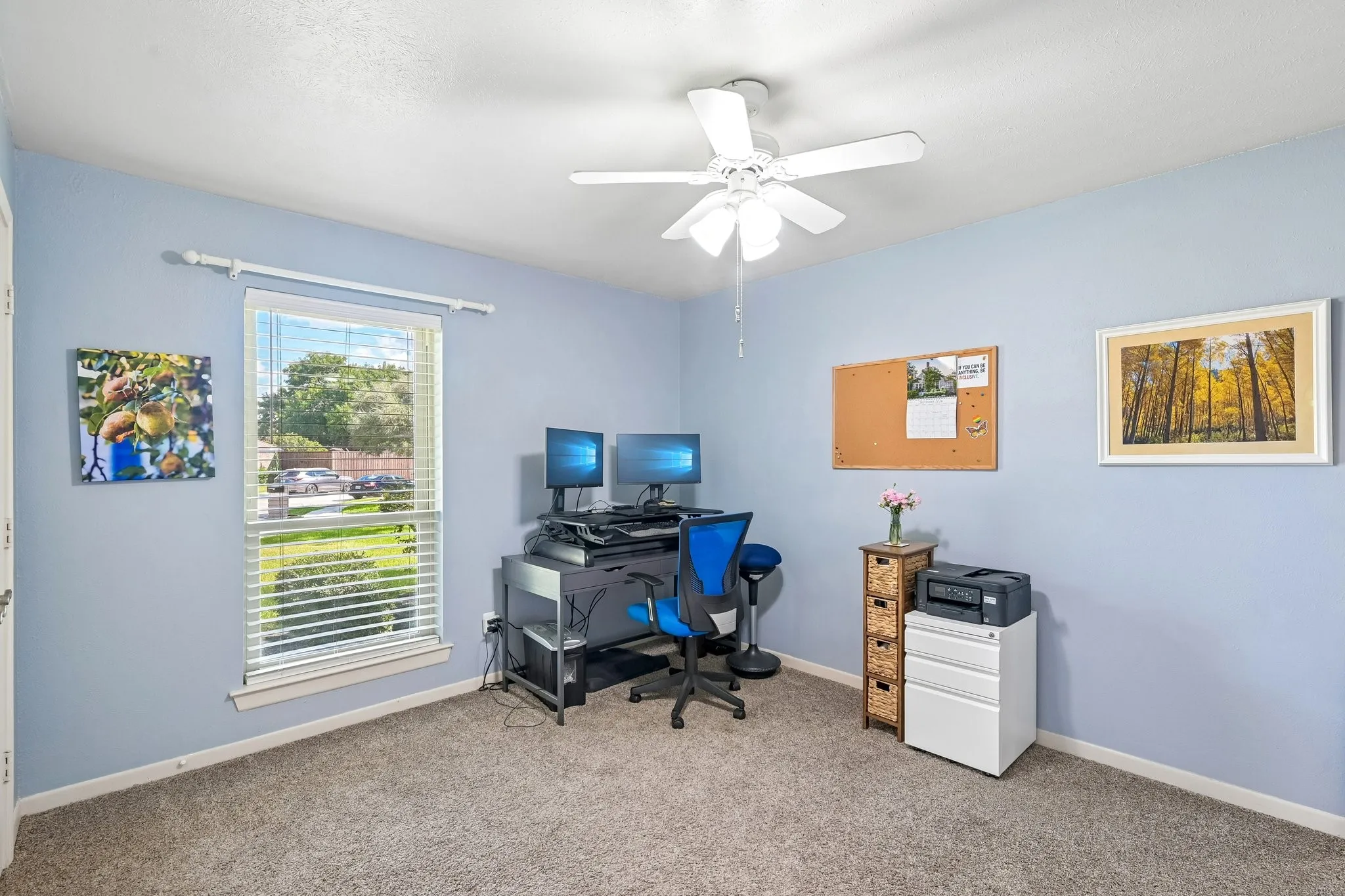 Recessed window with blinds, ceiling fan with light fixture, and carpet flooring