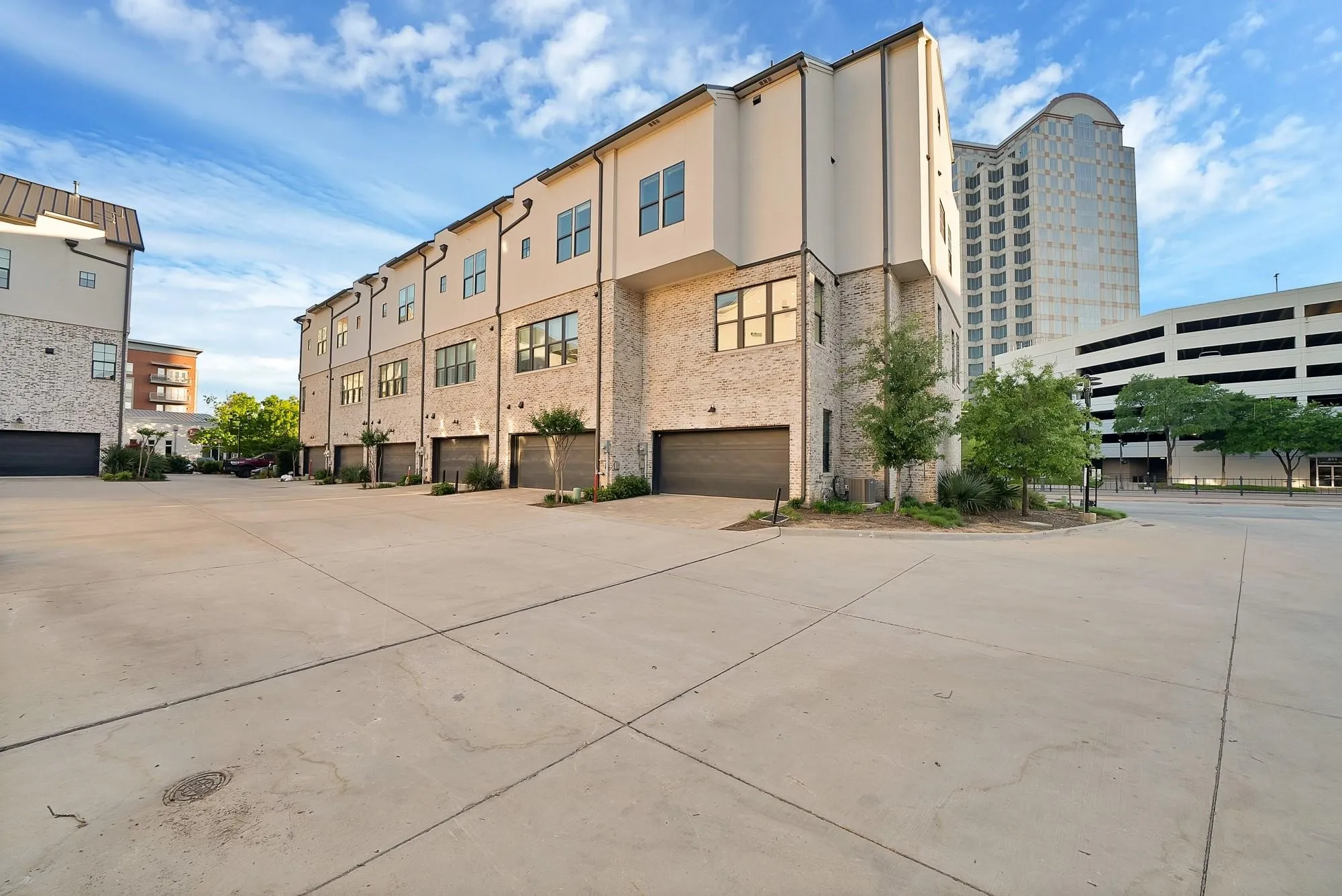 Contemporary multi-story residences featuring brick and stucco exteriors