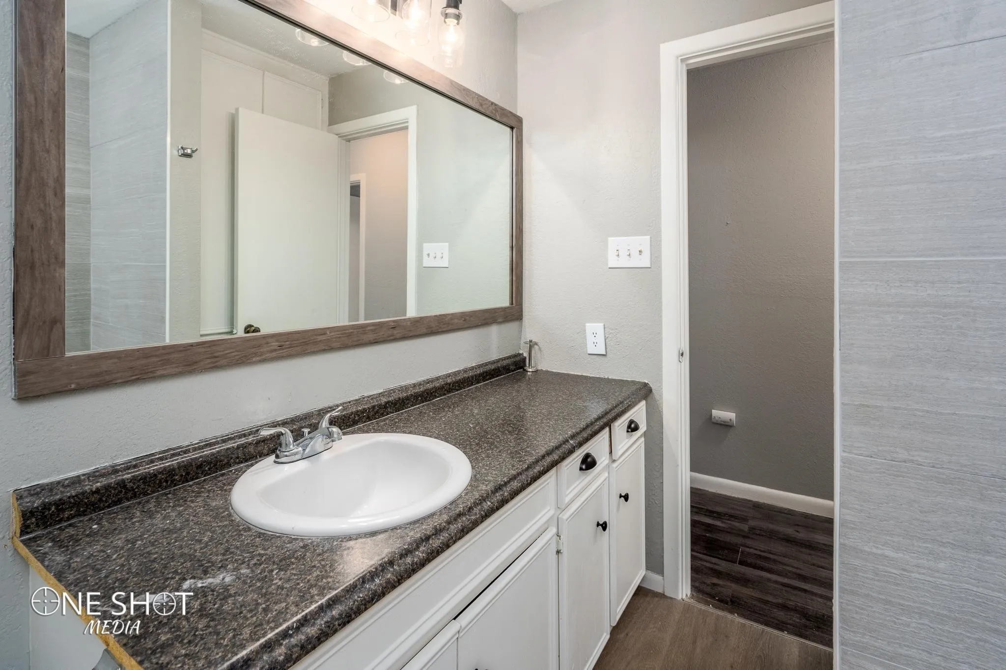 Bathroom featuring vanity and hardwood / wood-style flooring