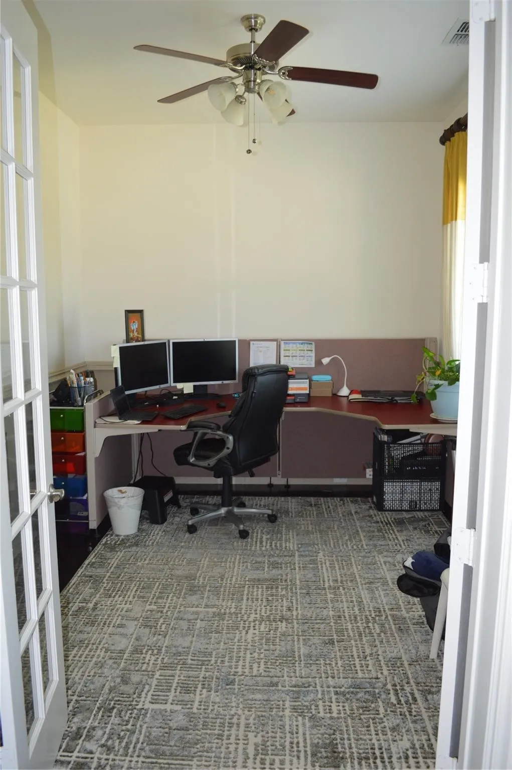 Office space featuring a ceiling fan