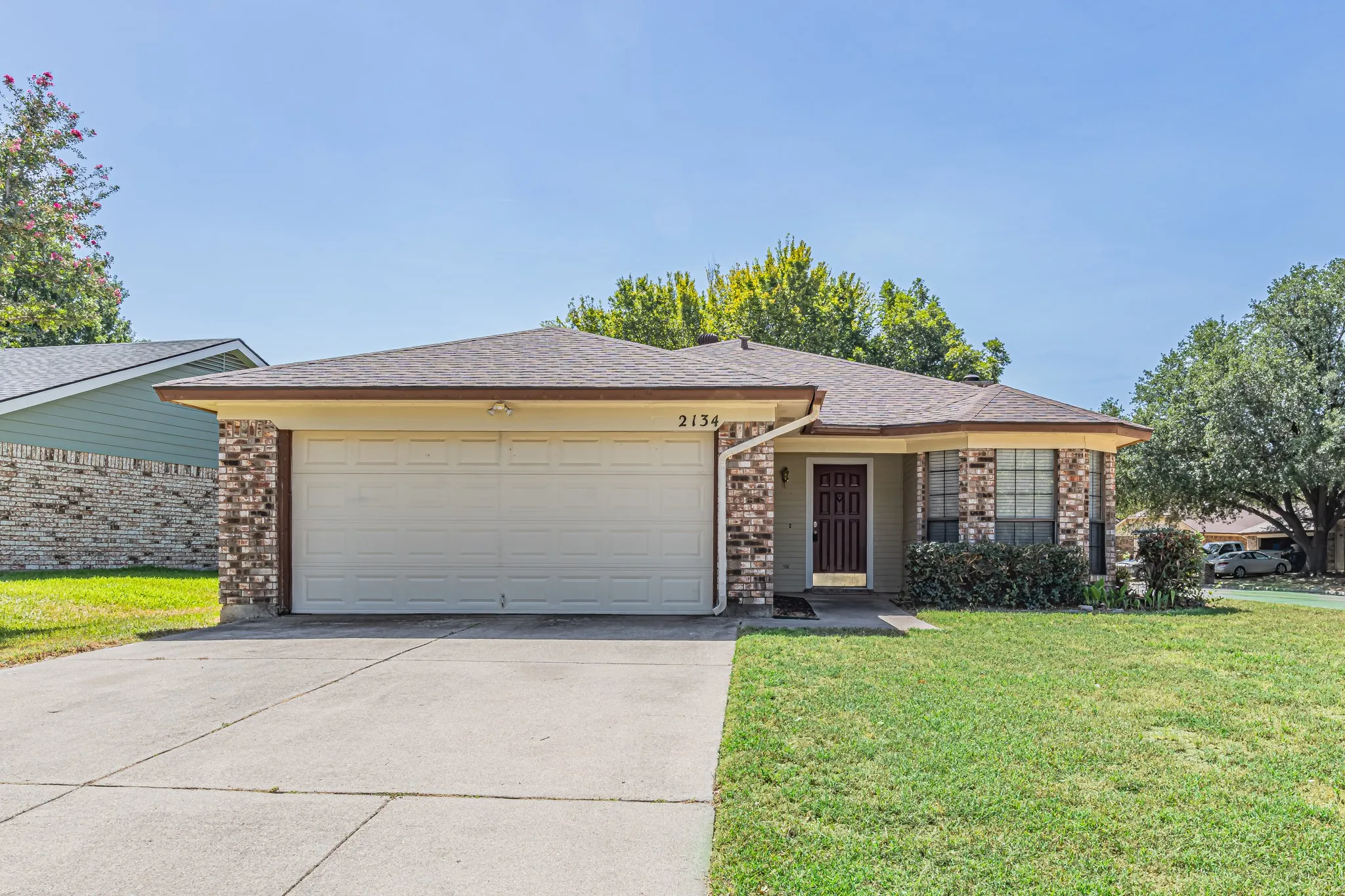Spacious two car garage. The windows surround the dinning area.
