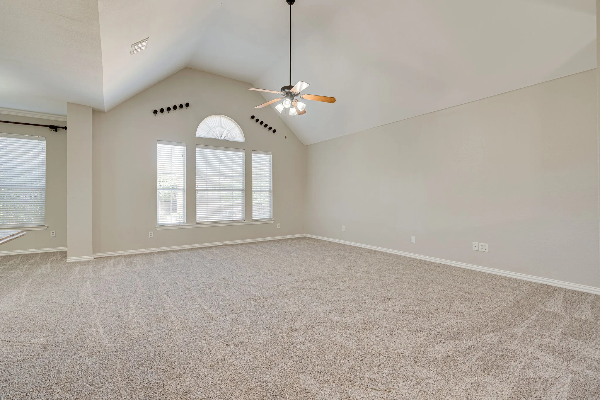 Spacious Living Room features tons of natural light.