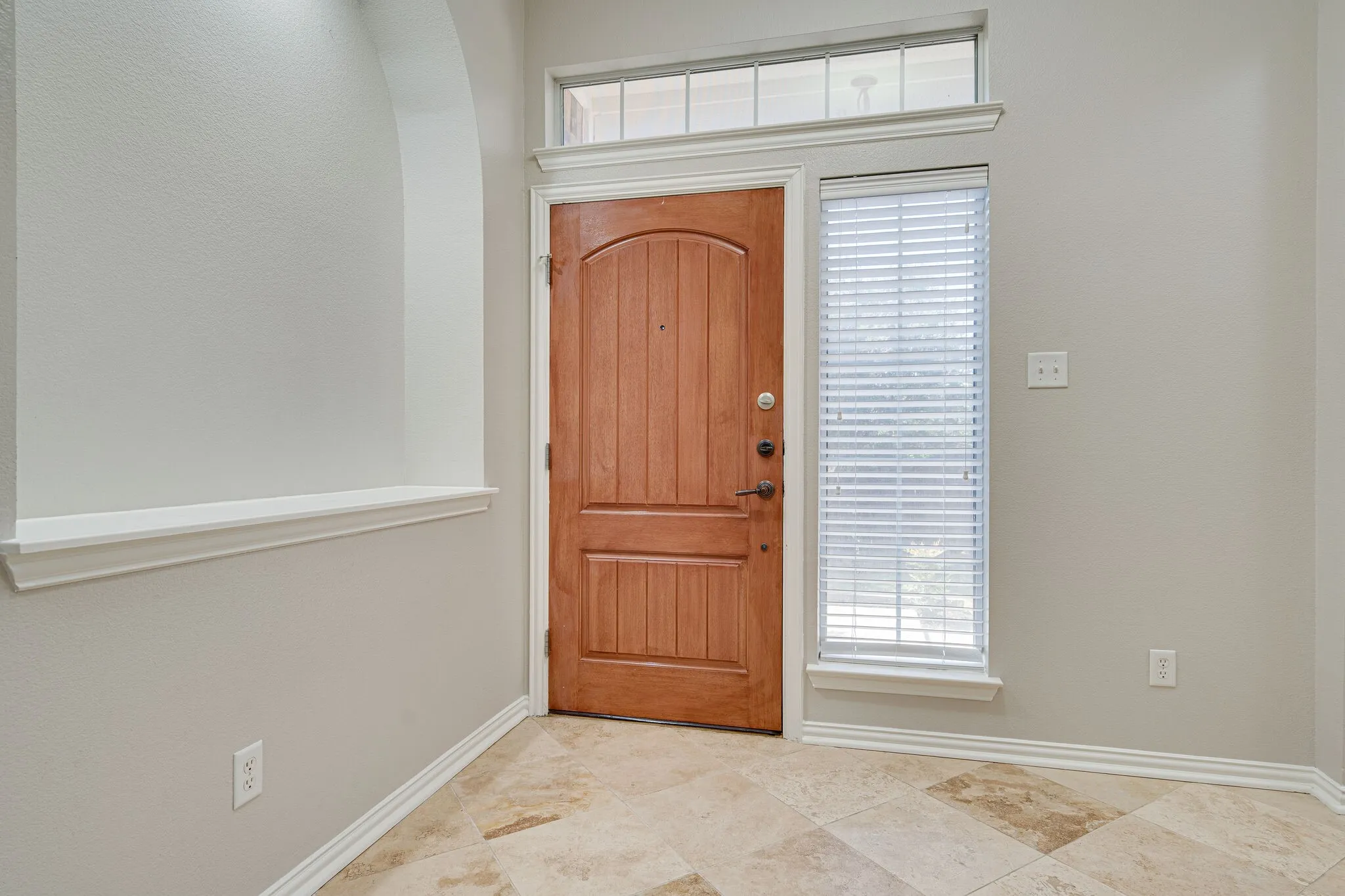 Foyer with beautiful Travertine tile.