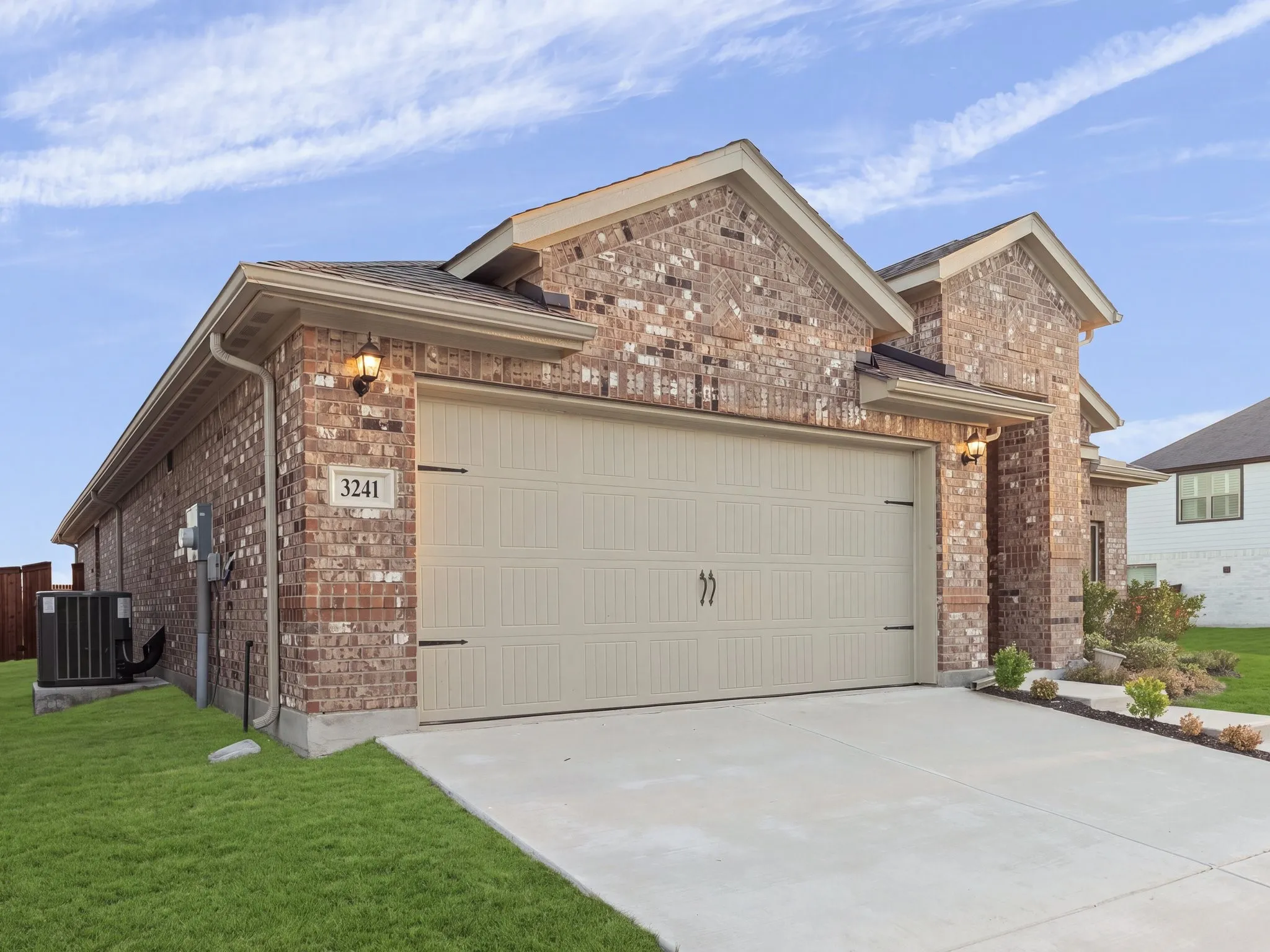 Brick exterior with decorative gables and light-colored soffit