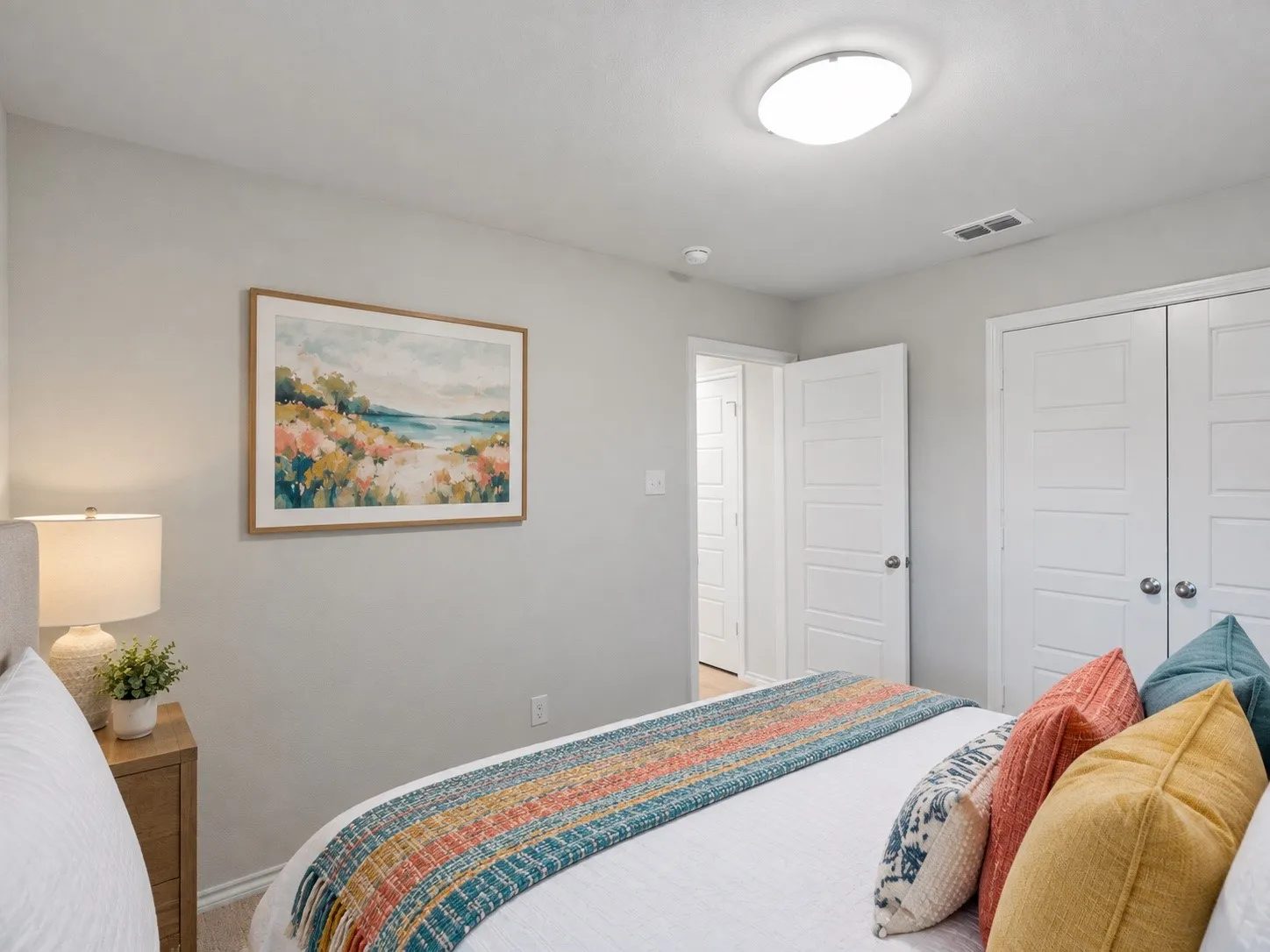 Recessed ceiling light, paneled interior doors, and neutral wall tones