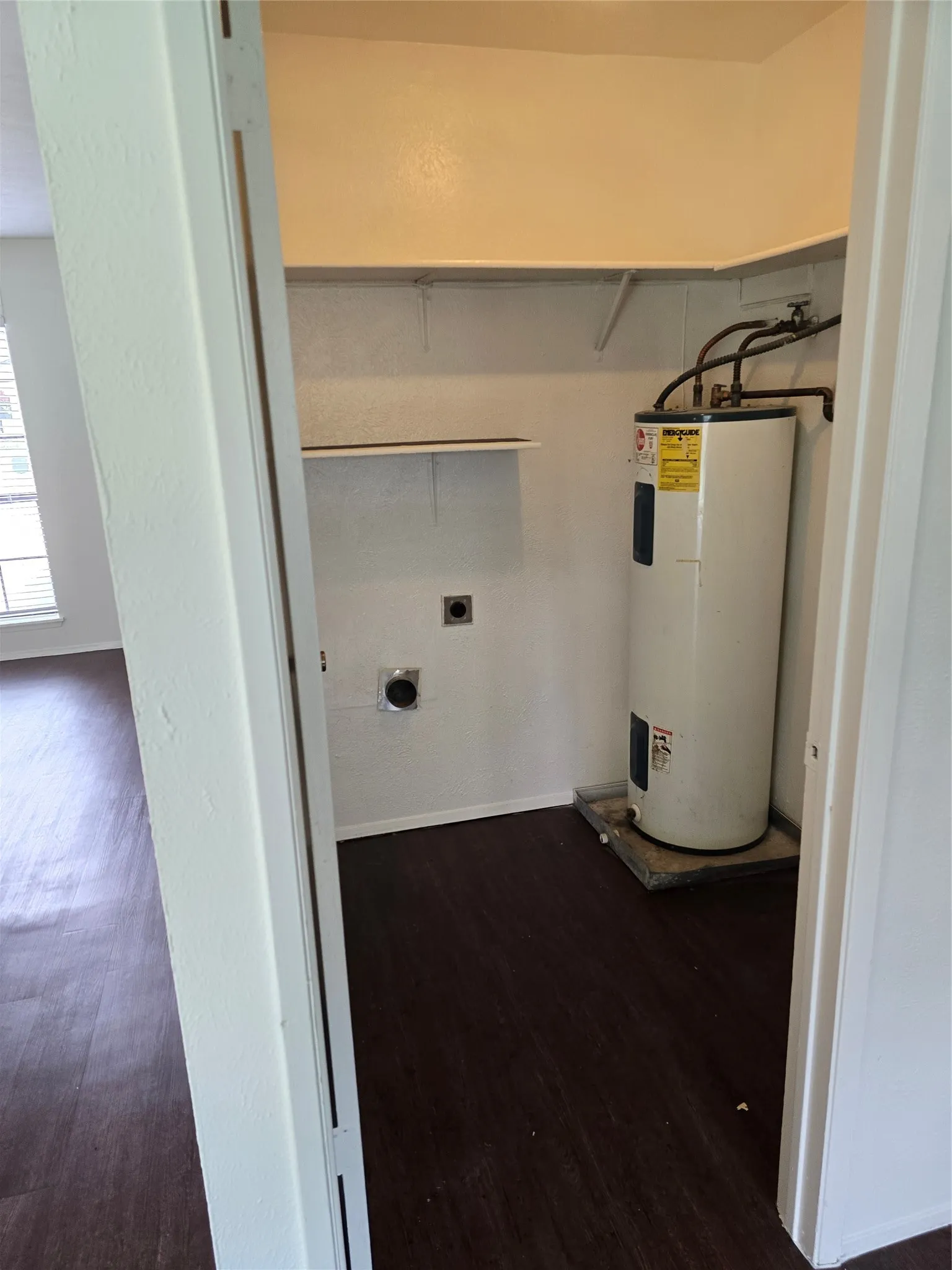 located off kitchen.  looking at dryer connections