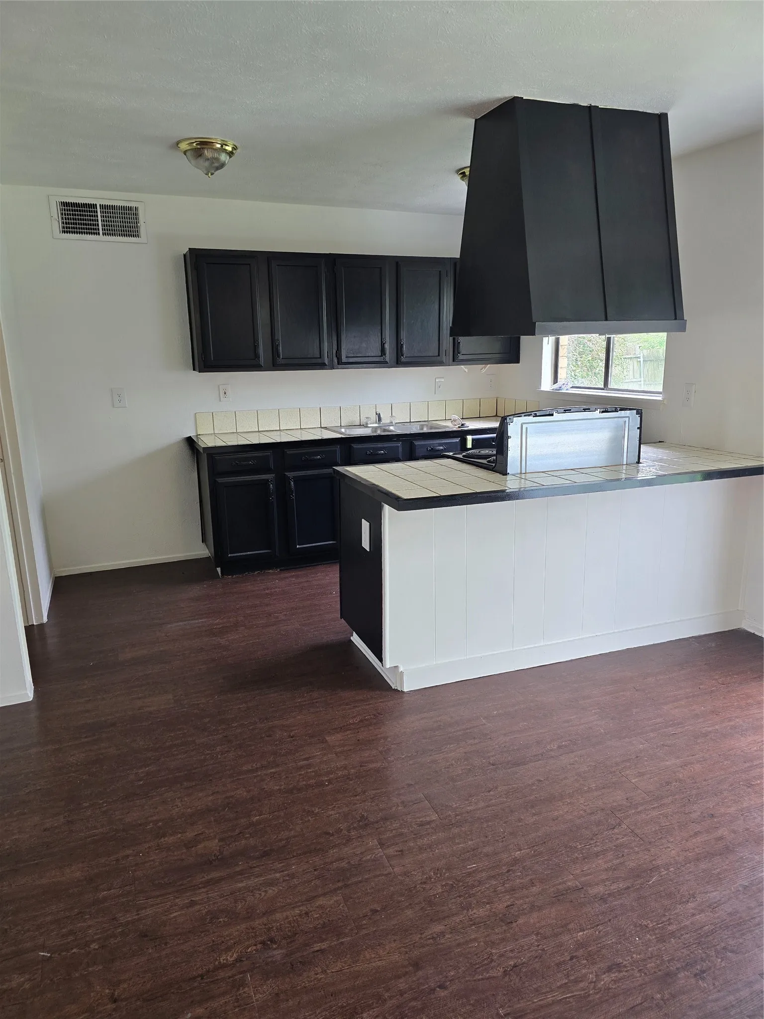 Looking into kitchen from dining