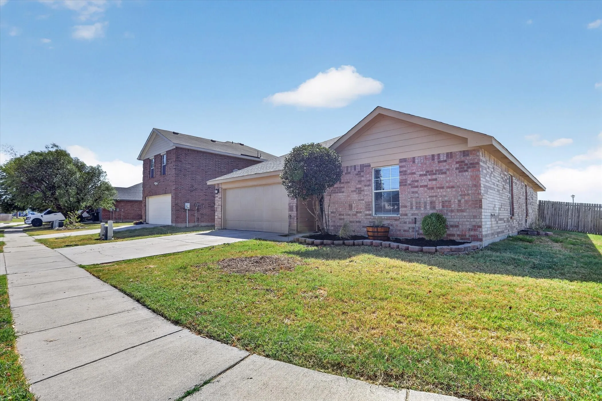Brick facade with beige siding