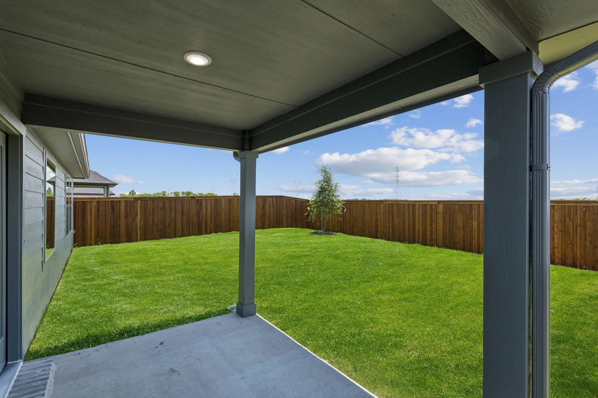 Patio in the Harper home plan by Trophy Signature Homes – REPRESENTATIVE PHOTO