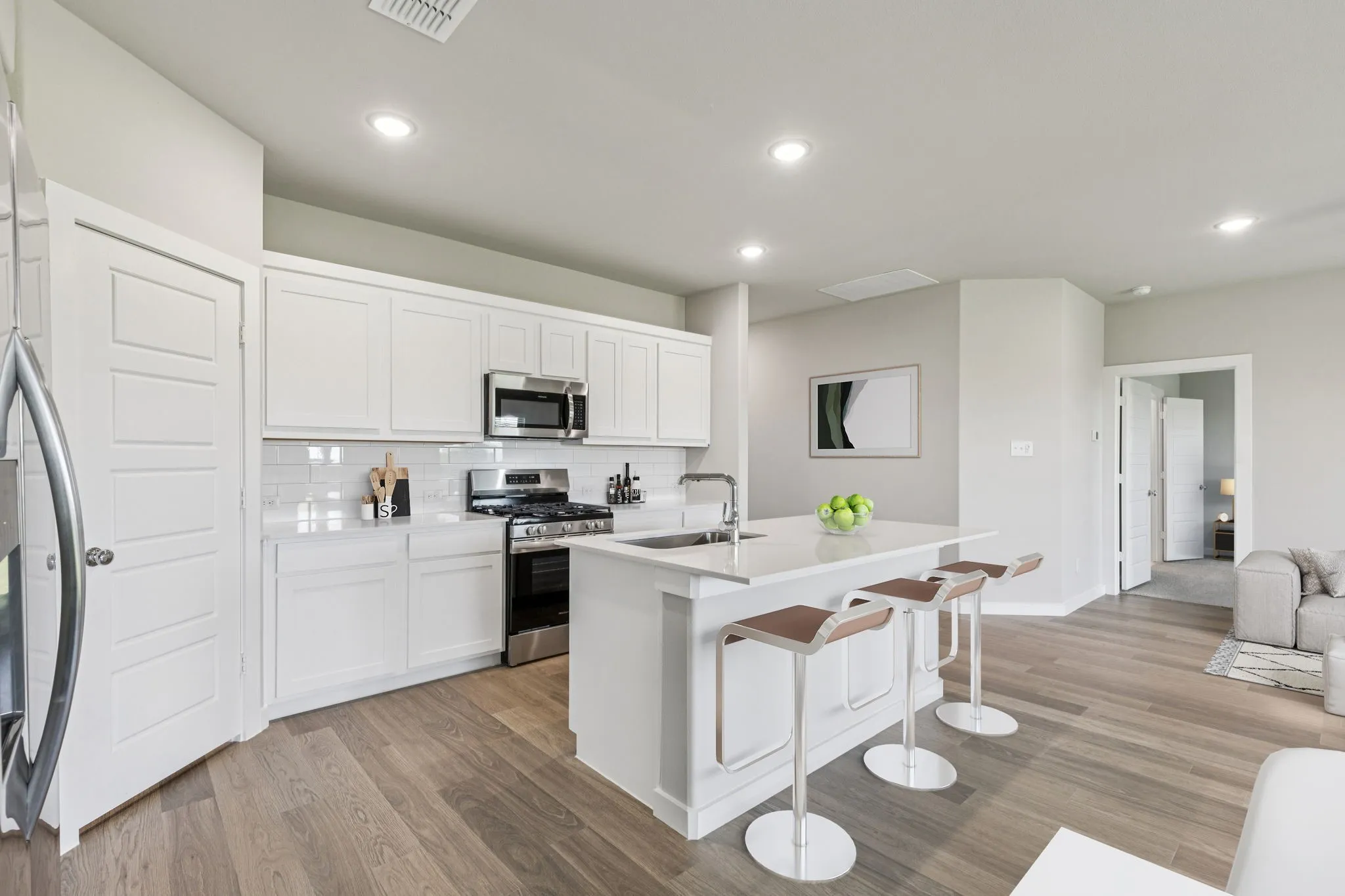 Kitchen in the Harper home plan by Trophy Signature Homes – REPRESENTATIVE PHOTO