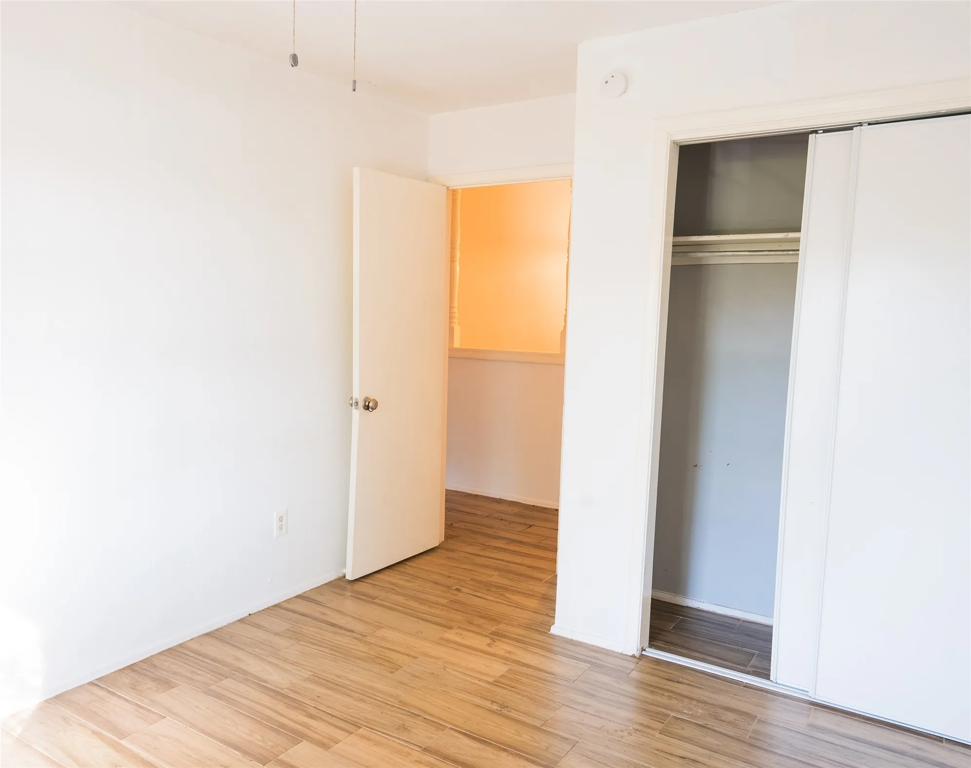 Wood-finish flooring with white walls