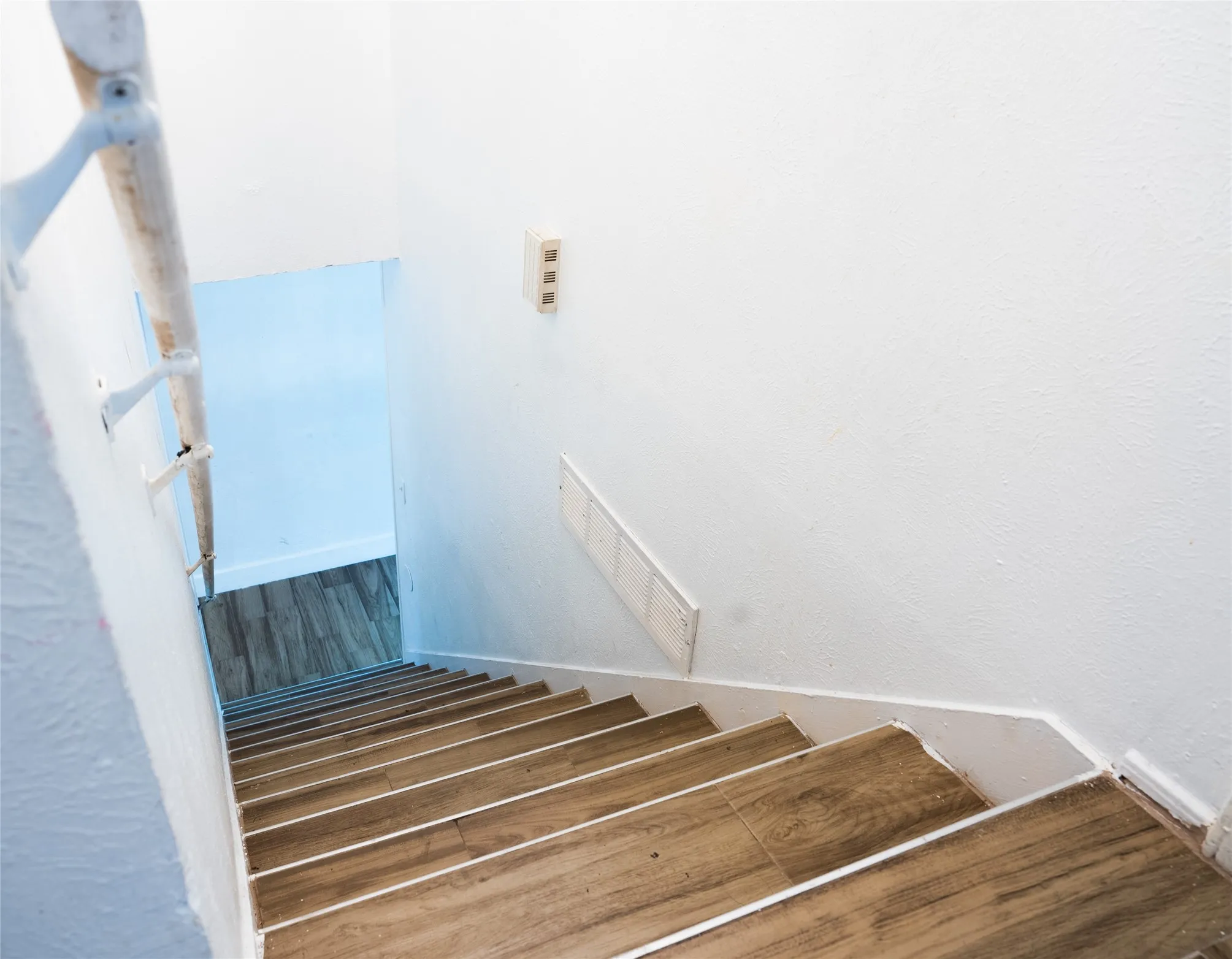 Staircase with wood-finish treads and white risers