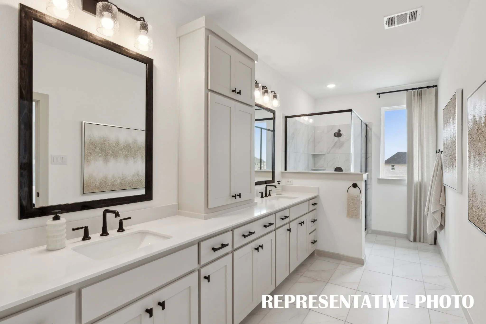 Filled with style, sophistication and space, this fantastic owner's bath was built for two!  REPRESENTATIVE PHOTO
