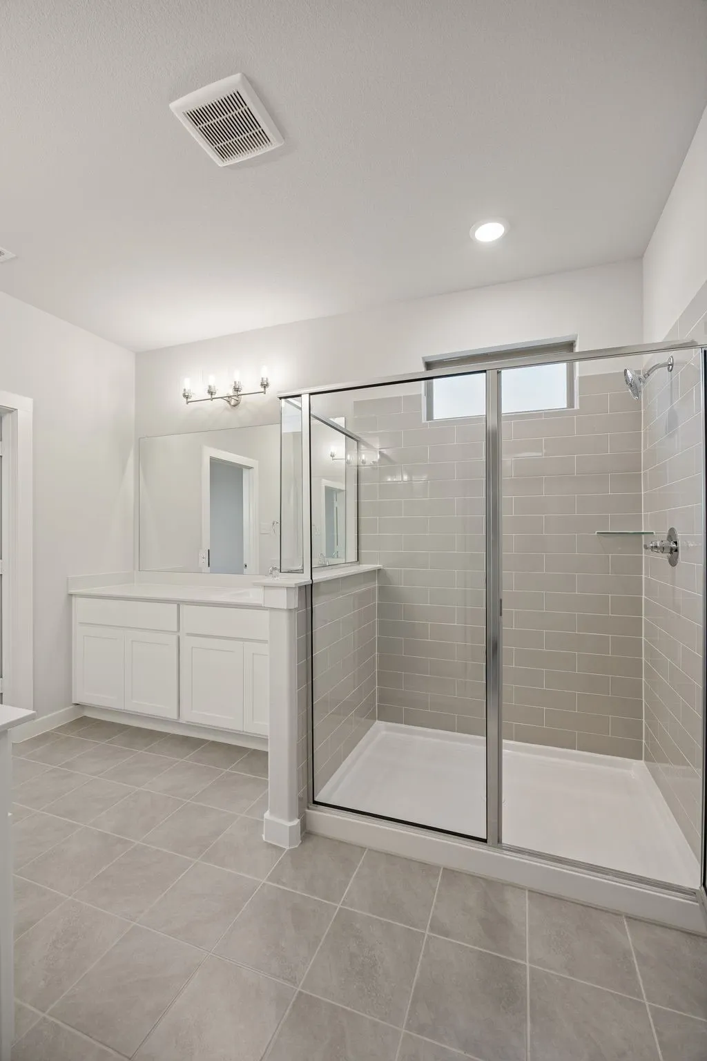 Primary Bathroom in the Wimbledon home plan by Trophy Signature Homes – REPRESENTATIVE PHOTO