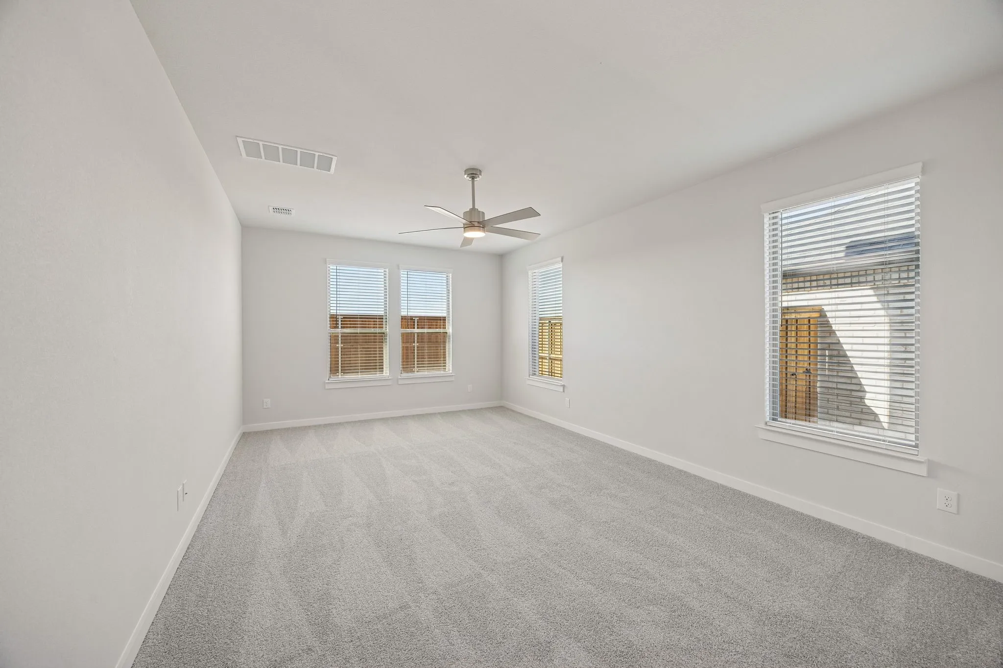 Primary Suite in the Wimbledon home plan by Trophy Signature Homes – REPRESENTATIVE PHOTO
