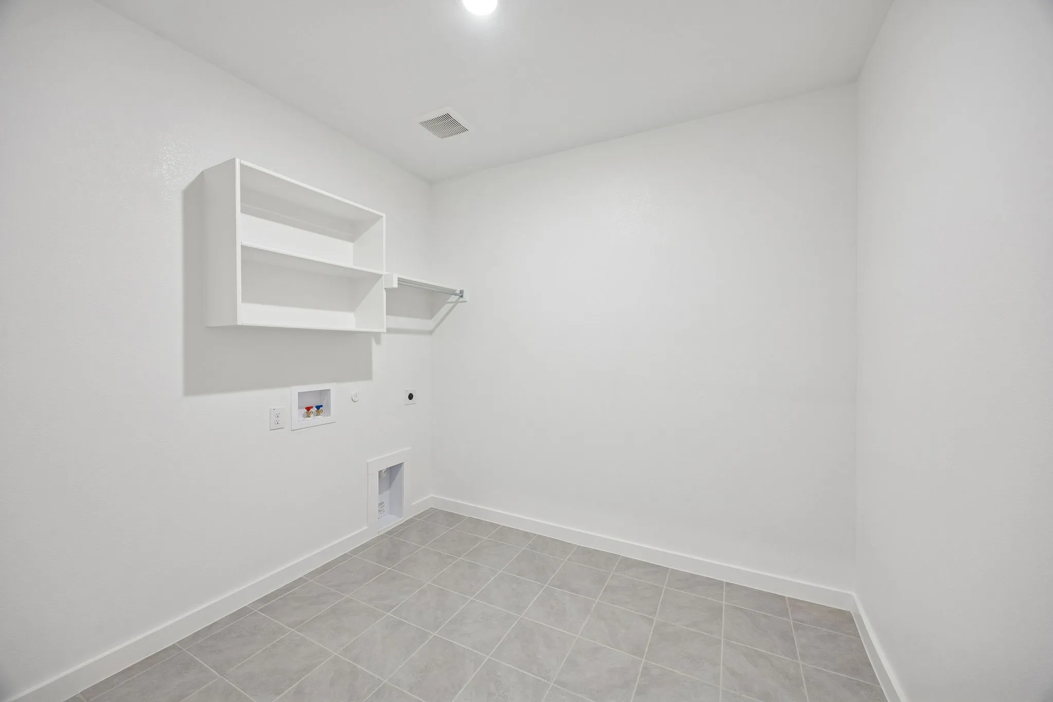 Utility Room in the Wimbledon home plan by Trophy Signature Homes – REPRESENTATIVE PHOTO