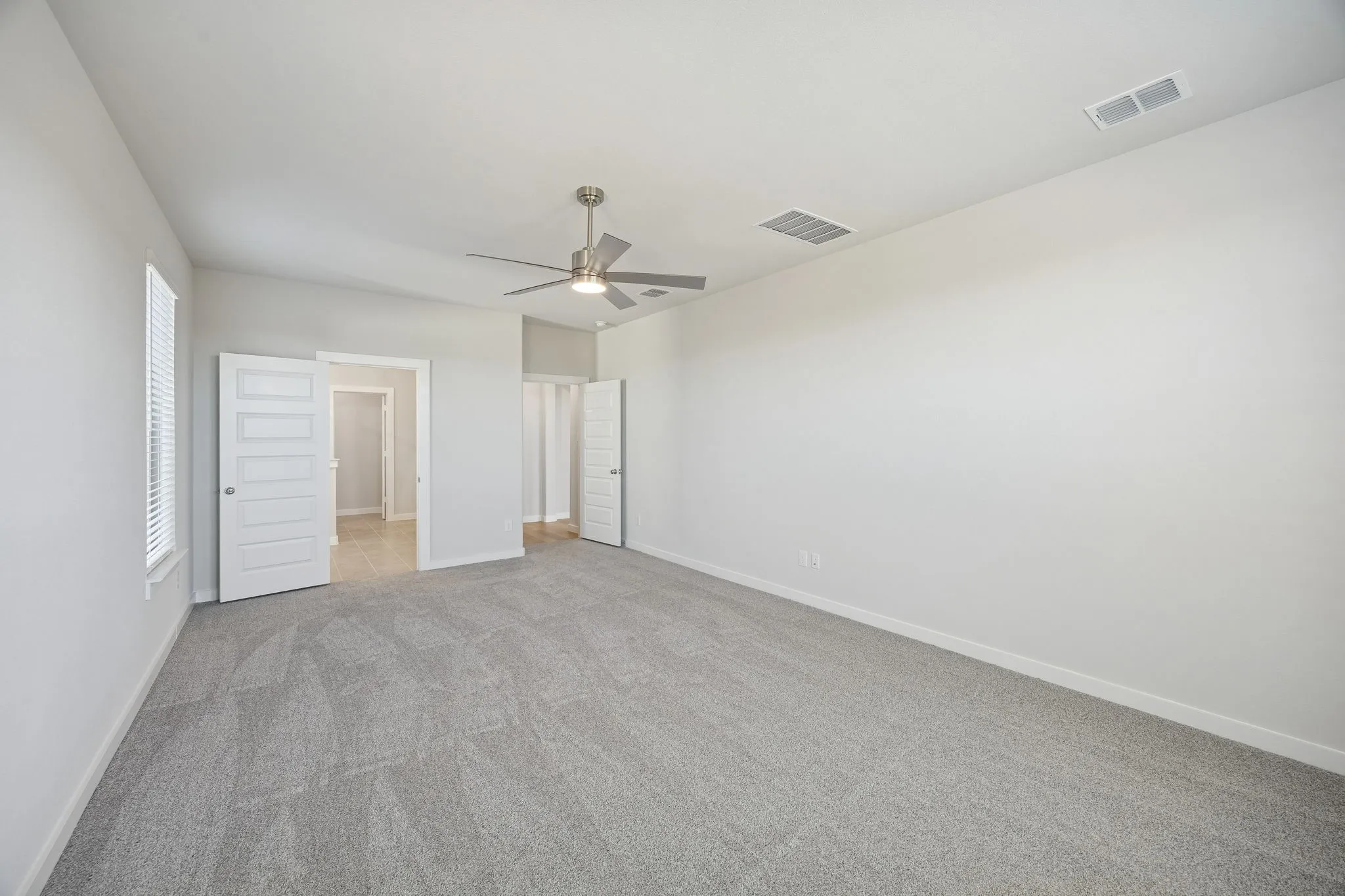 Primary Suite in the Wimbledon home plan by Trophy Signature Homes – REPRESENTATIVE PHOTO