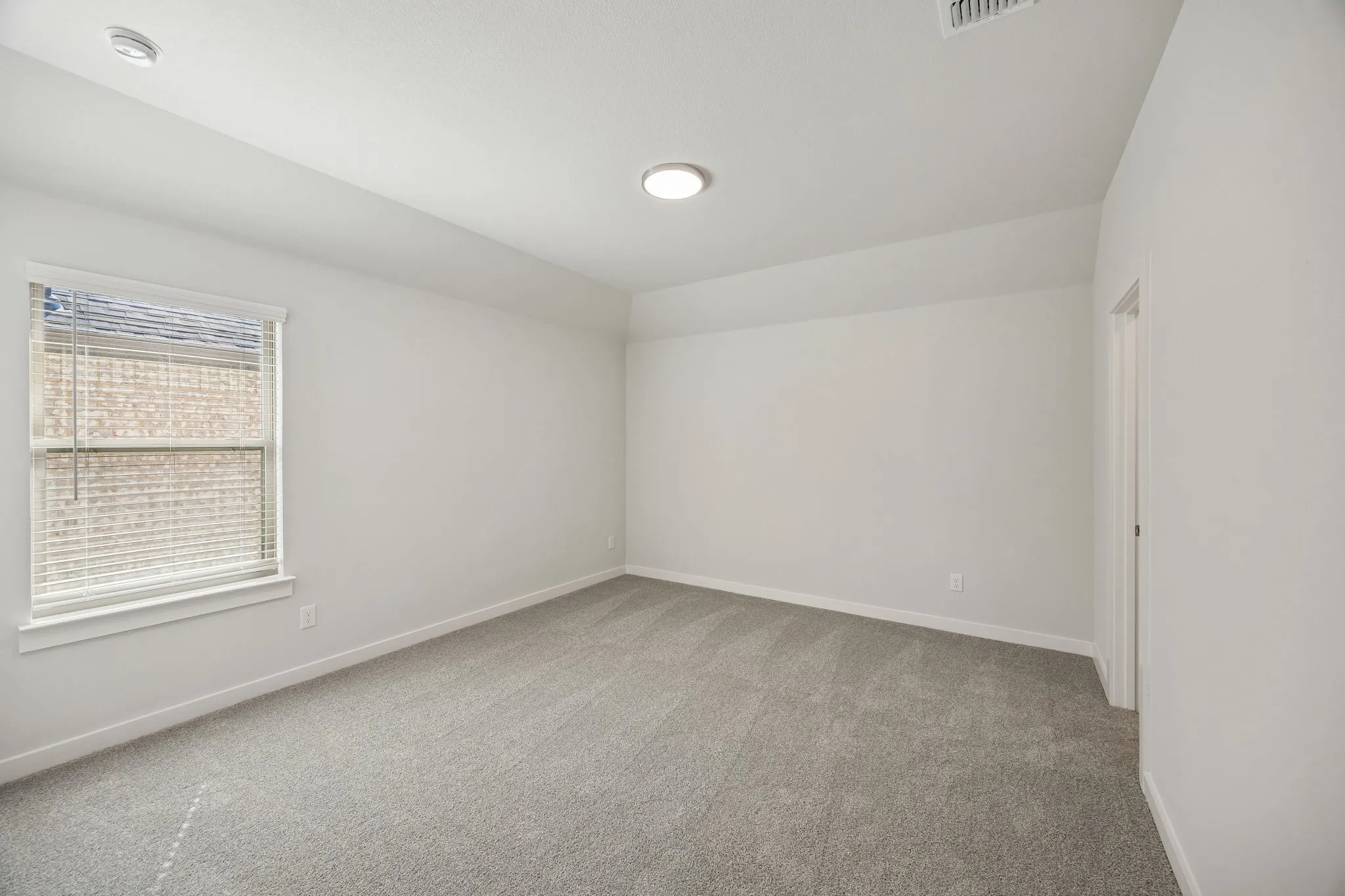 Bedroom in the Wimbledon home plan by Trophy Signature Homes – REPRESENTATIVE PHOTO