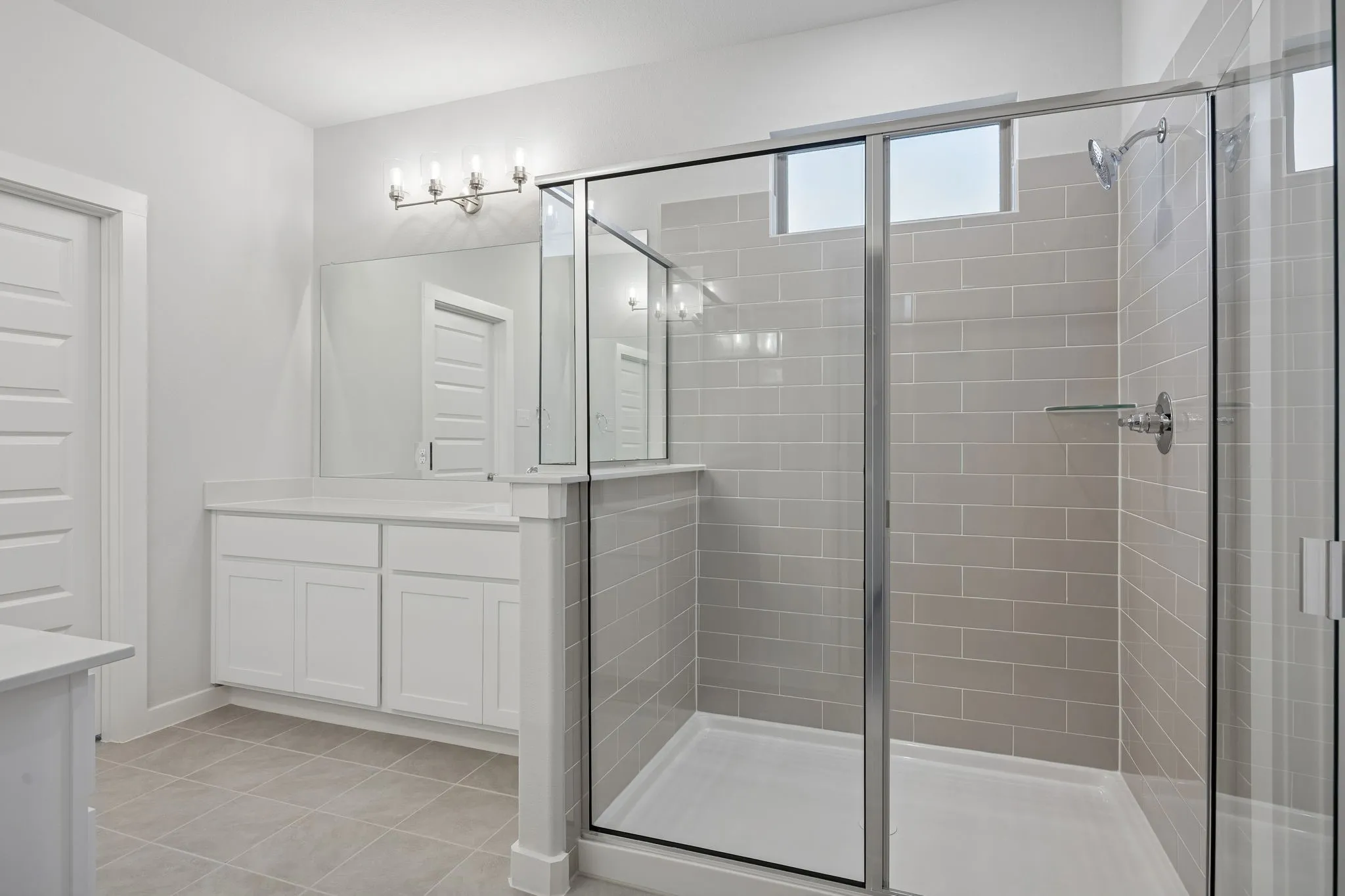 Primary Bathroom in the Wimbledon home plan by Trophy Signature Homes – REPRESENTATIVE PHOTO