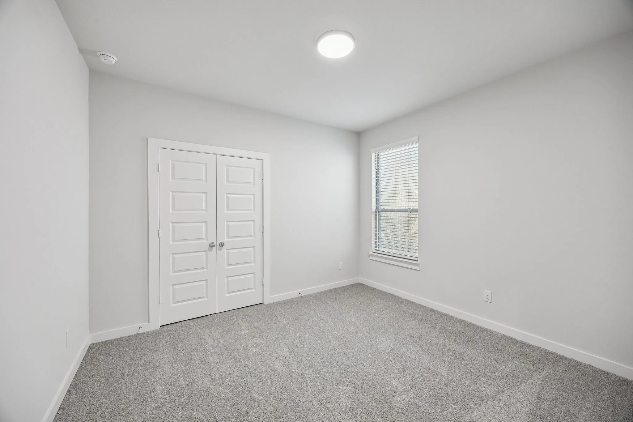 Bedroom in the Wimbledon home plan by Trophy Signature Homes – REPRESENTATIVE PHOTO