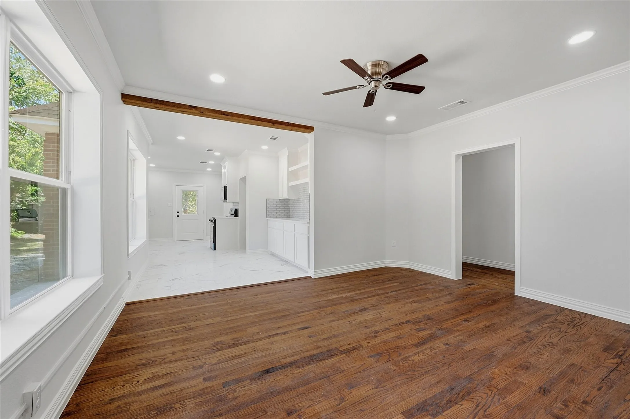 Hardwood flooring and recessed lighting throughout