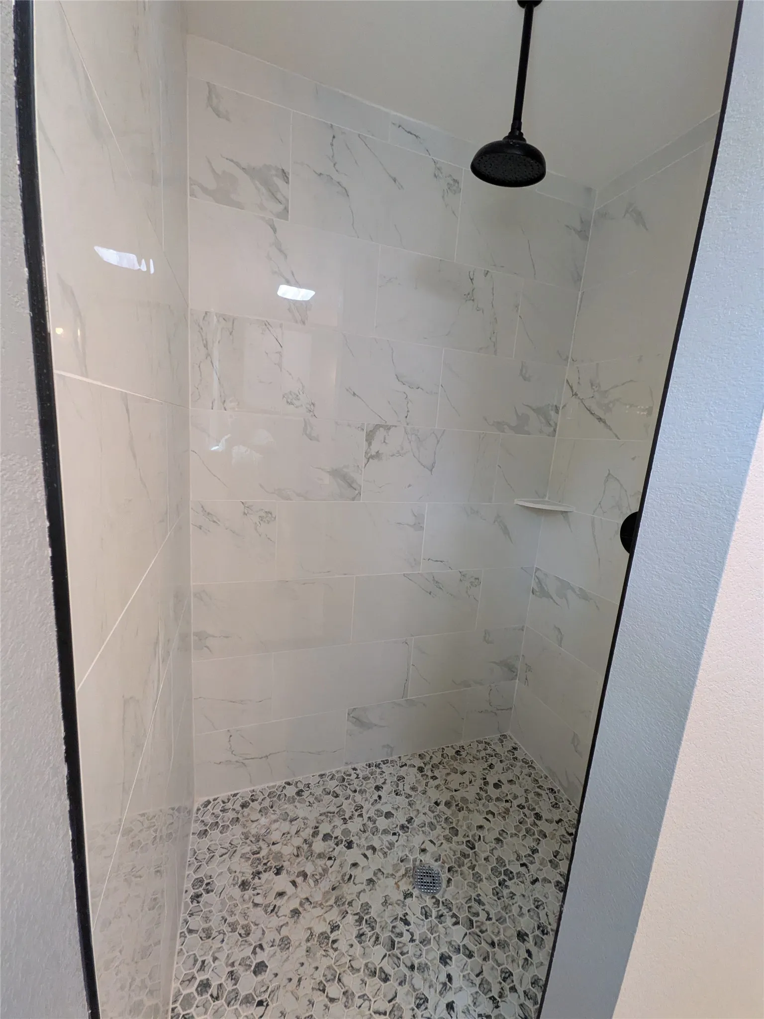 CUSTOM TILED SHOWER WITH RAIN WATER SHOWER HEAD